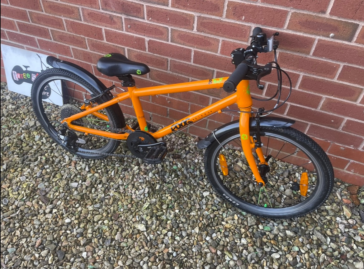 A Pre Loved Frog Bike For Sale, Orange Frog 55 Hybrid bicycle, 20” wheels, 8 speed, V brakes, mudguards, nationwide delivery is available.