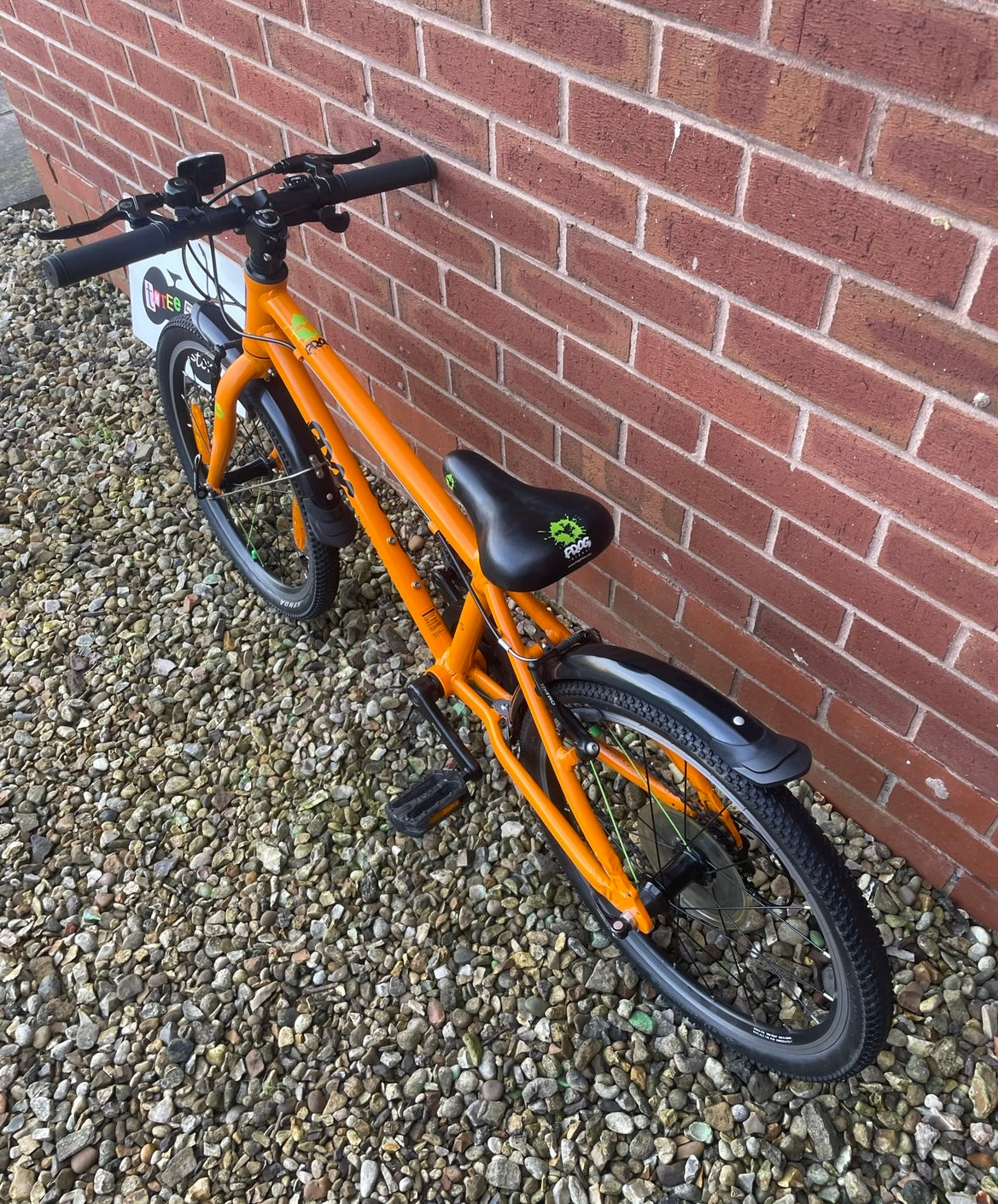 A Pre Loved Frog Bike For Sale, Orange Frog 55 Hybrid bicycle, 20” wheels, 8 speed, V brakes, mudguards, nationwide delivery is available.