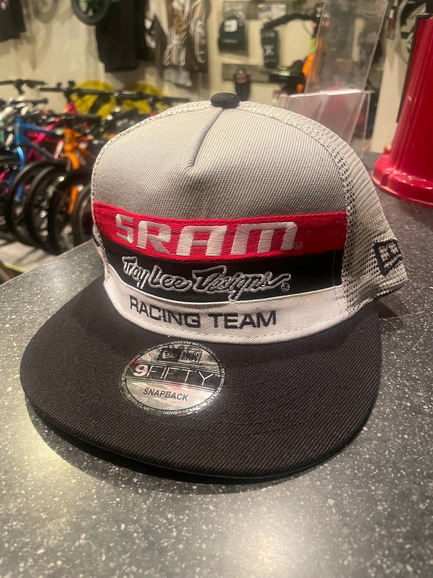 Troy Lee Designs SRAM New Era mesh trucker hat, snap back, black and black / grey.