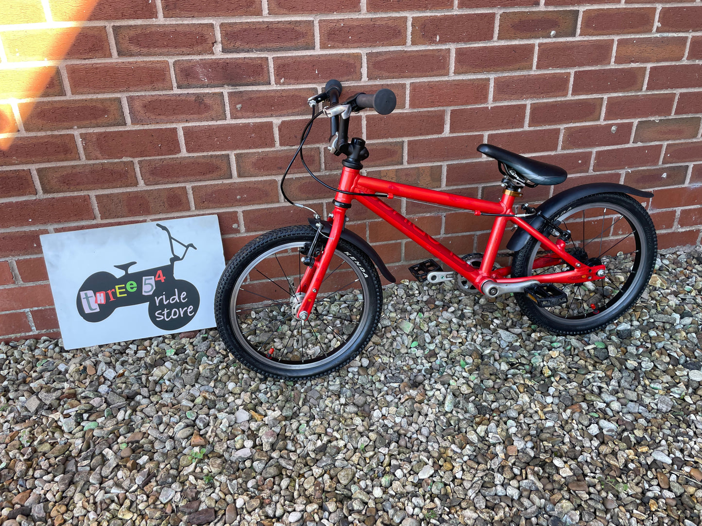 A Pre Loved Isla Bike For Sale, Red Isla Cnoc 16 First Pedal Bike, 16” wheels, V brakes, mudguards, very lightweight, nationwide delivery is available.