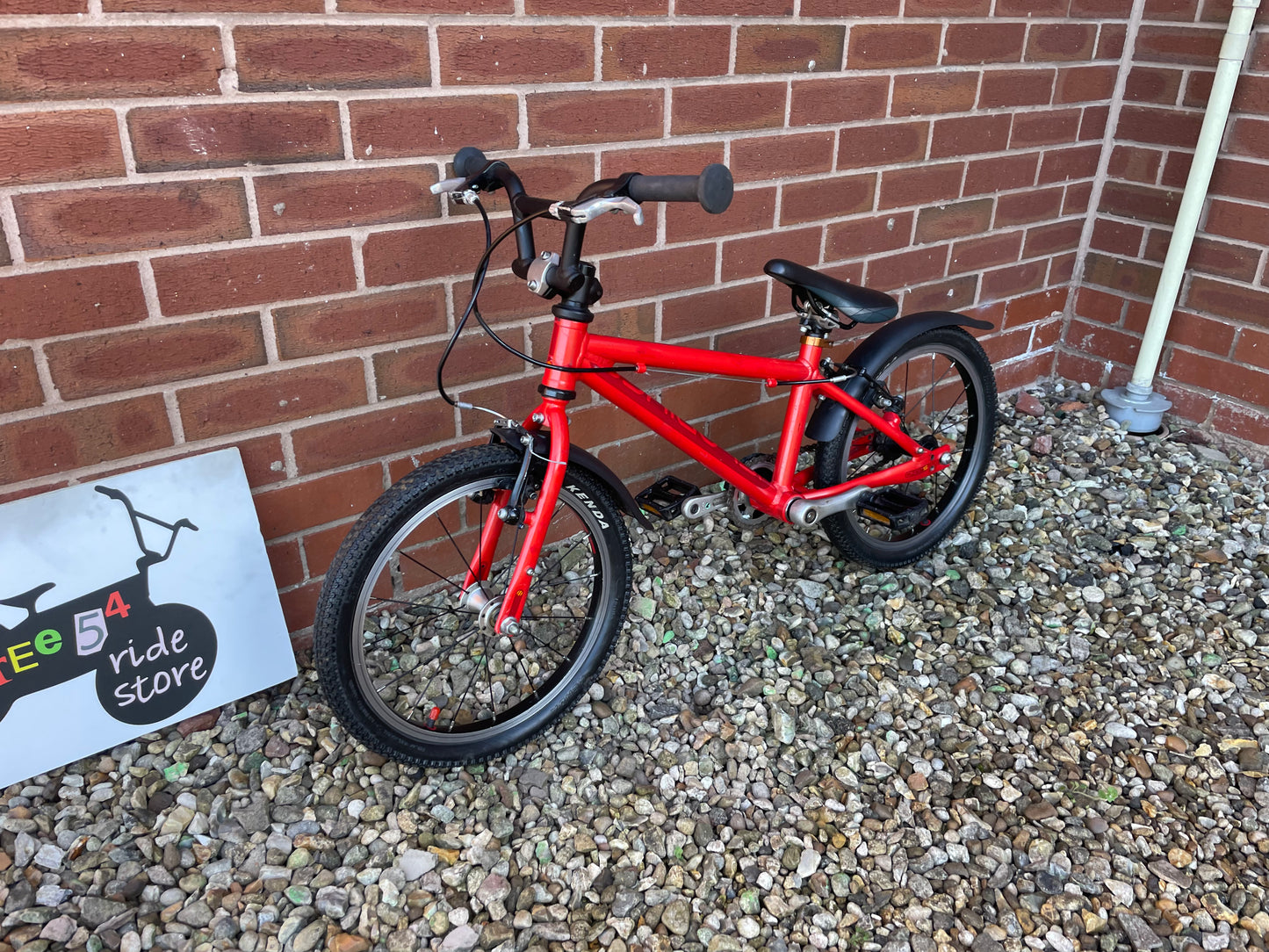 A Pre Loved Isla Bike For Sale, Red Isla Cnoc 16 First Pedal Bike, 16” wheels, V brakes, mudguards, very lightweight, nationwide delivery is available.
