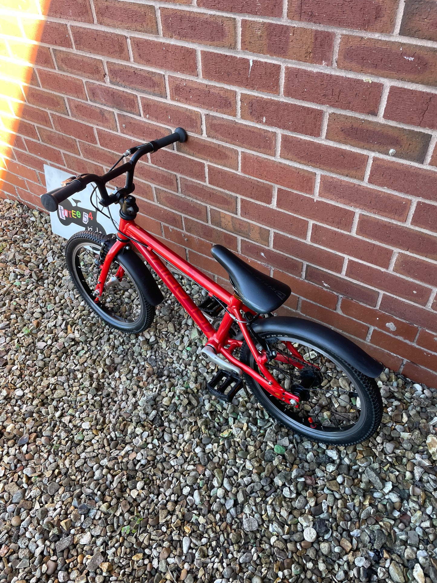 A Pre Loved Isla Bike For Sale, Red Isla Cnoc 16 First Pedal Bike, 16” wheels, V brakes, mudguards, very lightweight, nationwide delivery is available.