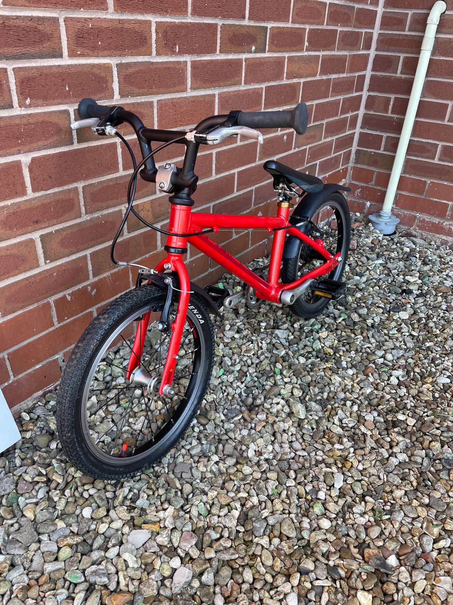 A Pre Loved Isla Bike For Sale, Red Isla Cnoc 16 First Pedal Bike, 16” wheels, V brakes, mudguards, very lightweight, nationwide delivery is available.