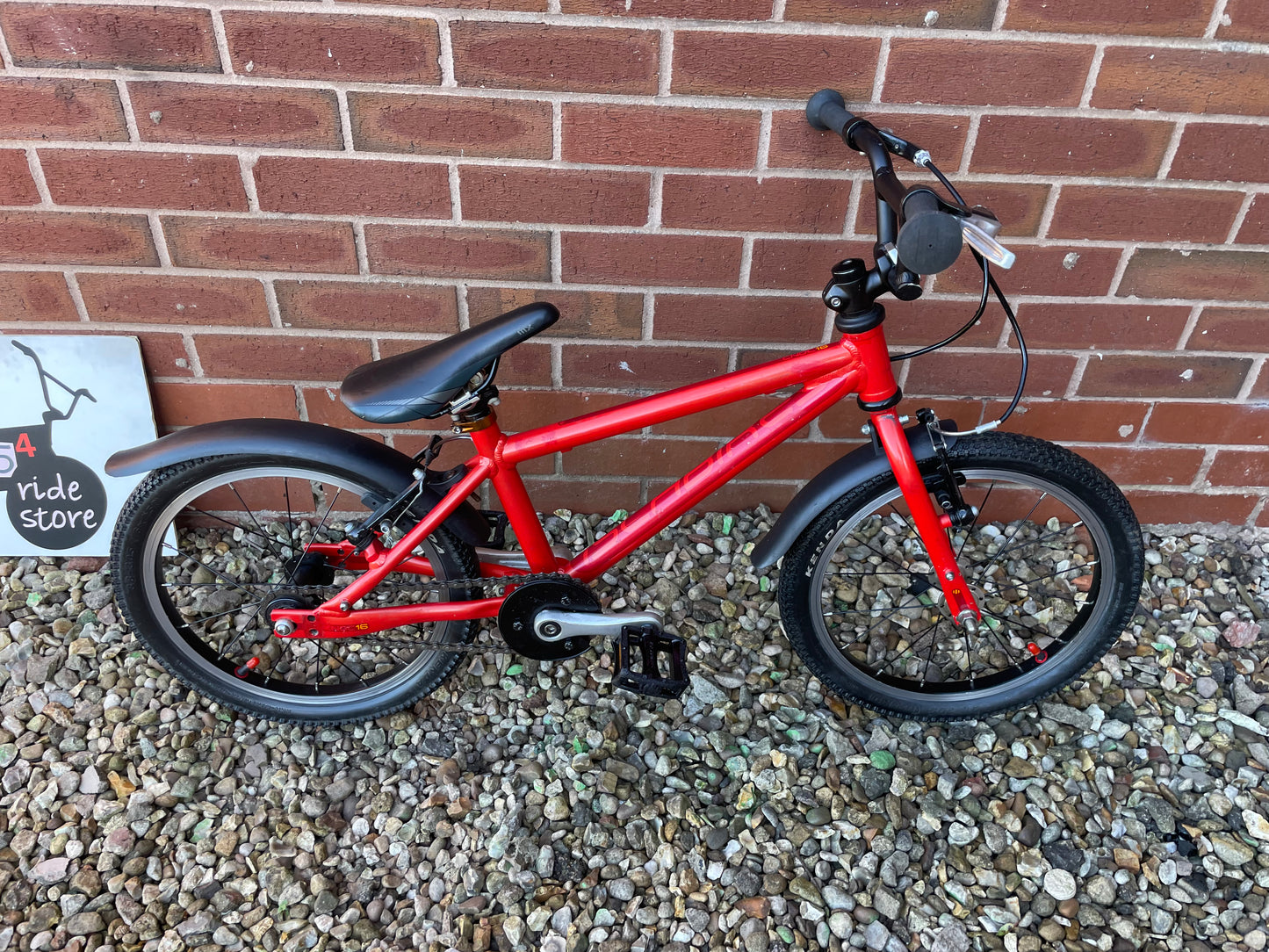 A Pre Loved Isla Bike For Sale, Red Isla Cnoc 16 First Pedal Bike, 16” wheels, V brakes, mudguards, very lightweight, nationwide delivery is available.