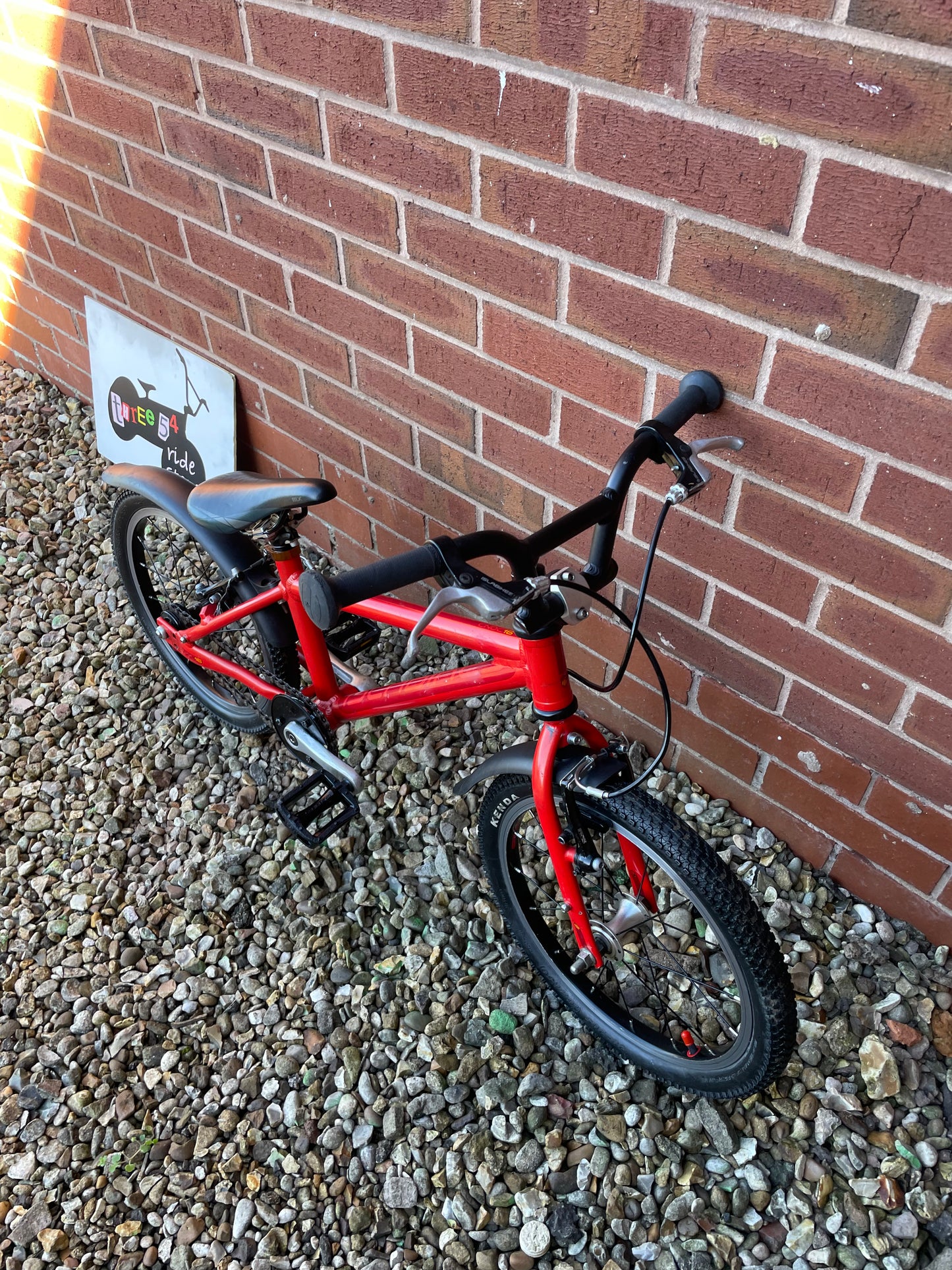 A Pre Loved Isla Bike For Sale, Red Isla Cnoc 16 First Pedal Bike, 16” wheels, V brakes, mudguards, very lightweight, nationwide delivery is available.