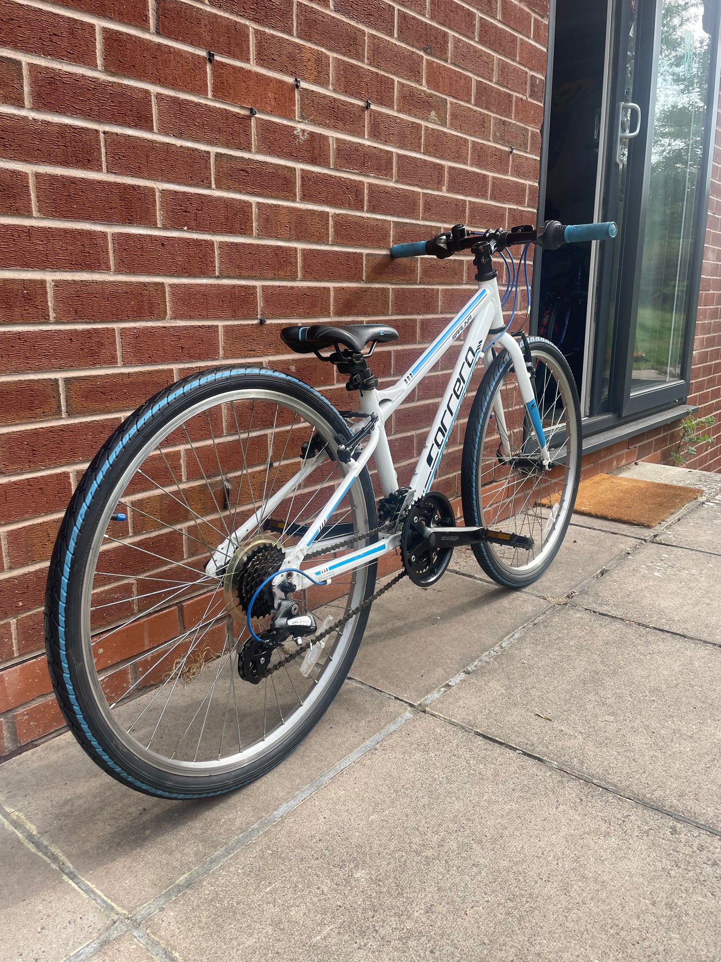A Pre Loved Carrera For Sale, 26” Carrera Saruna, white and blue, 21 speed, V brakes, very lightweight, nationwide delivery is available.