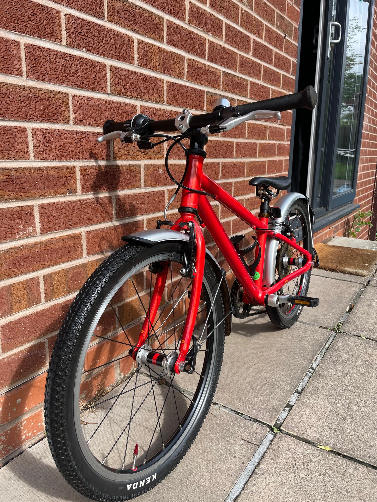 A Pre Loved Isla Bike For Sale, Red Isla Beinn 20s, 20” wheels, 8 speed, mudguards, bottle cage, very lightweight children’s bike, nationwide delivery is available.