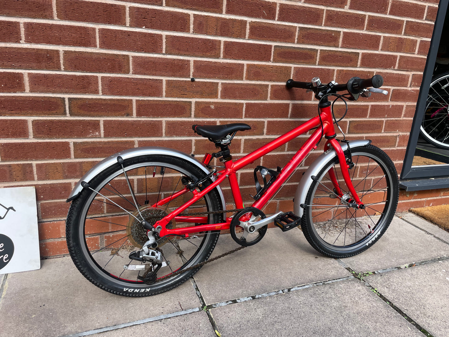A Pre Loved Isla Bike For Sale, Red Isla Beinn 20s, 20” wheels, 8 speed, mudguards, bottle cage, very lightweight children’s bike, nationwide delivery is available.