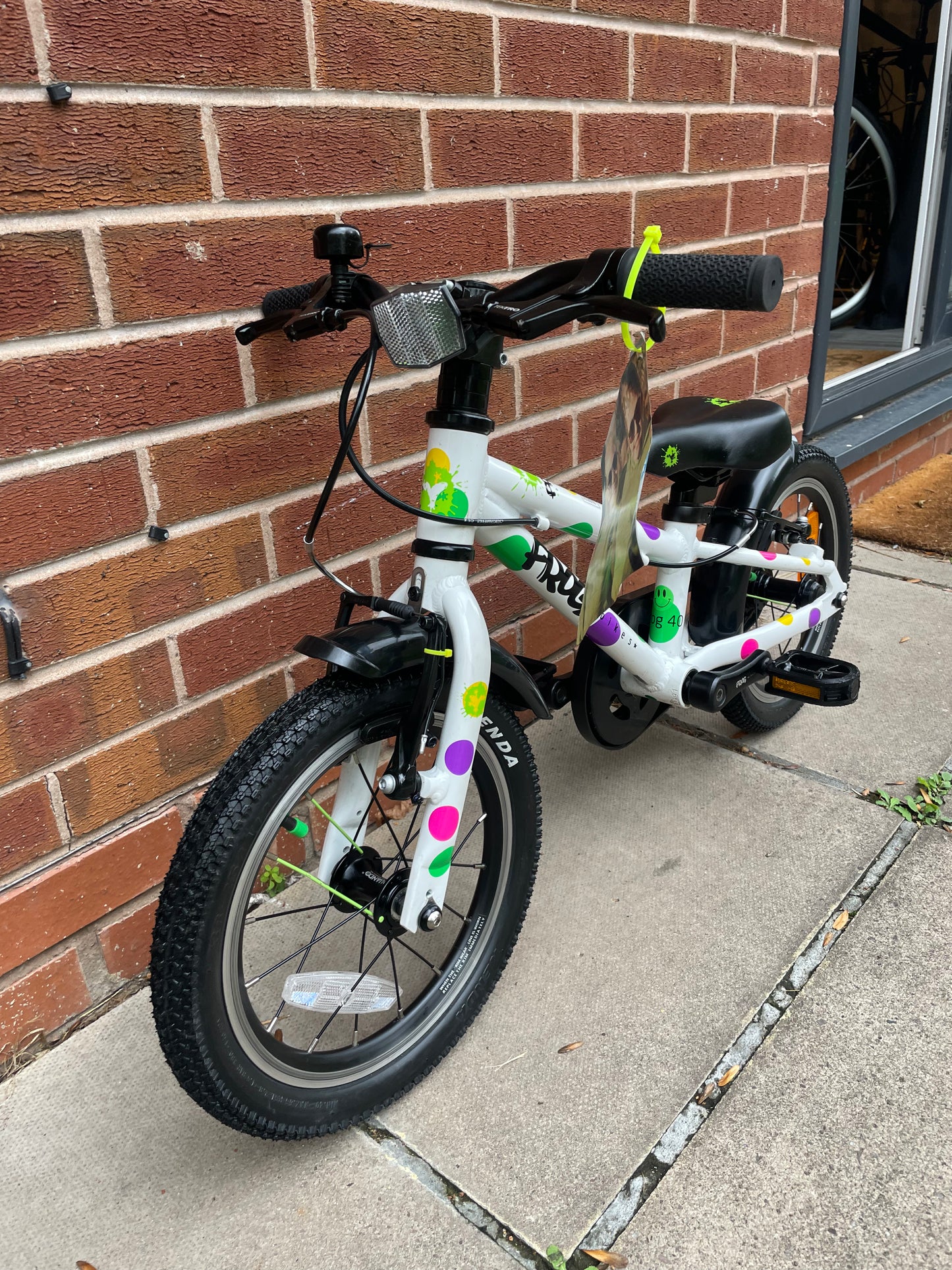A Pre Loved Frog Bike For Sale, White Spotty Frog 40 first pedal bike, 14” wheels, single speed, padded seat, V brakes, fully enclosed chain, mudguards, nationwide delivery is available.