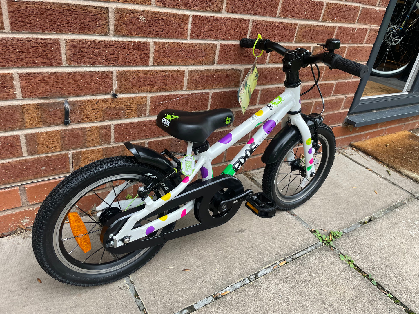 A Pre Loved Frog Bike For Sale, White Spotty Frog 40 first pedal bike, 14” wheels, single speed, padded seat, V brakes, fully enclosed chain, mudguards, nationwide delivery is available.