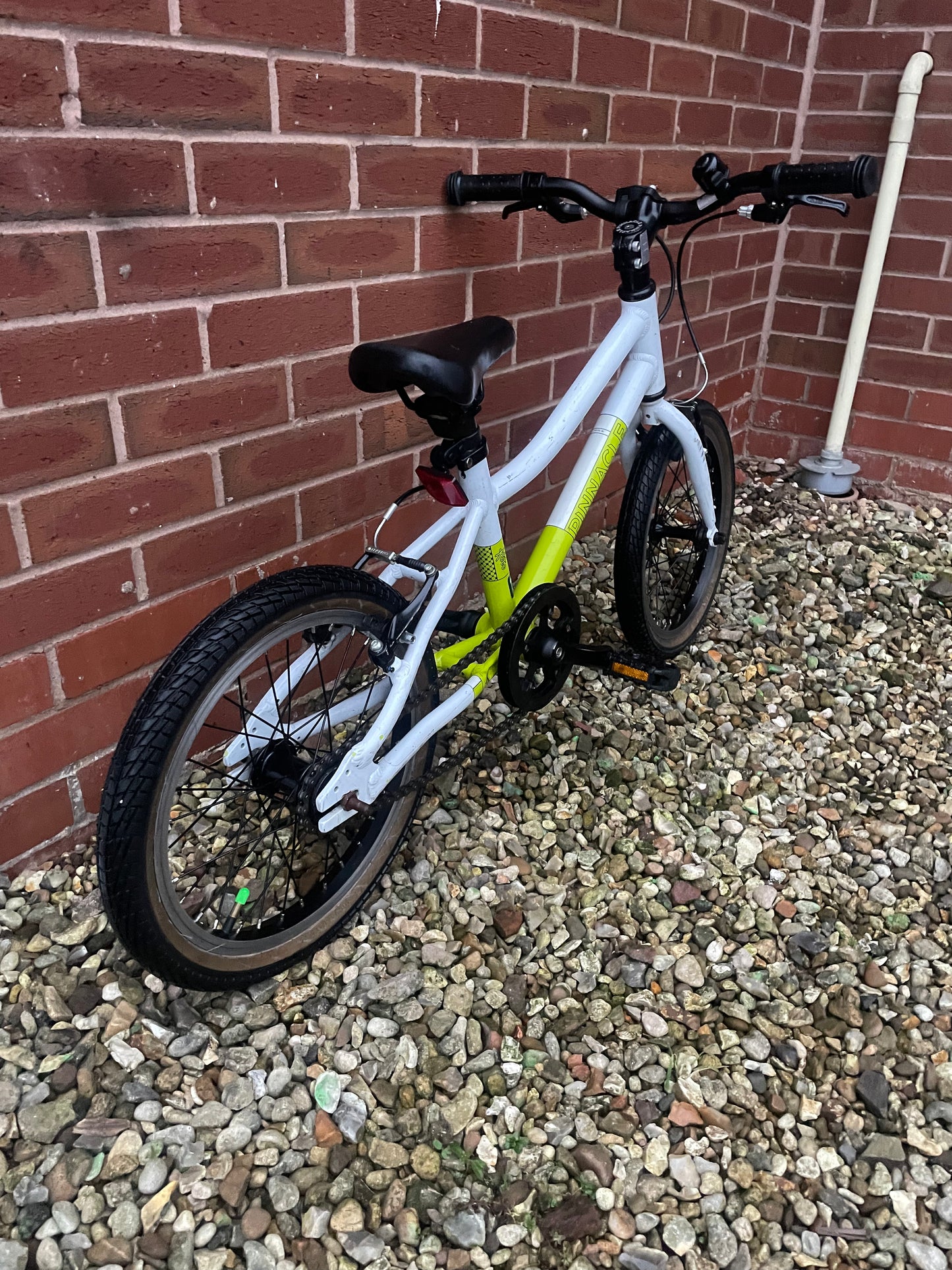 A Refurbished Pinnacle Bike For Sale, white/green, 16β wheels, single speed, V brakes, very lightweight, nationwide delivery is available.