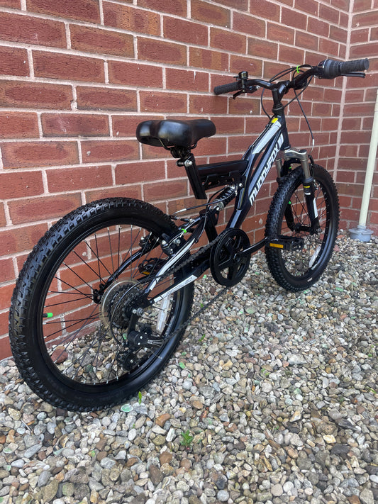 A Pre Loved Muddy Fox full suspension 20” youth mountain bike For Sale, Black, V brakes, padded seat, nationwide delivery is available.