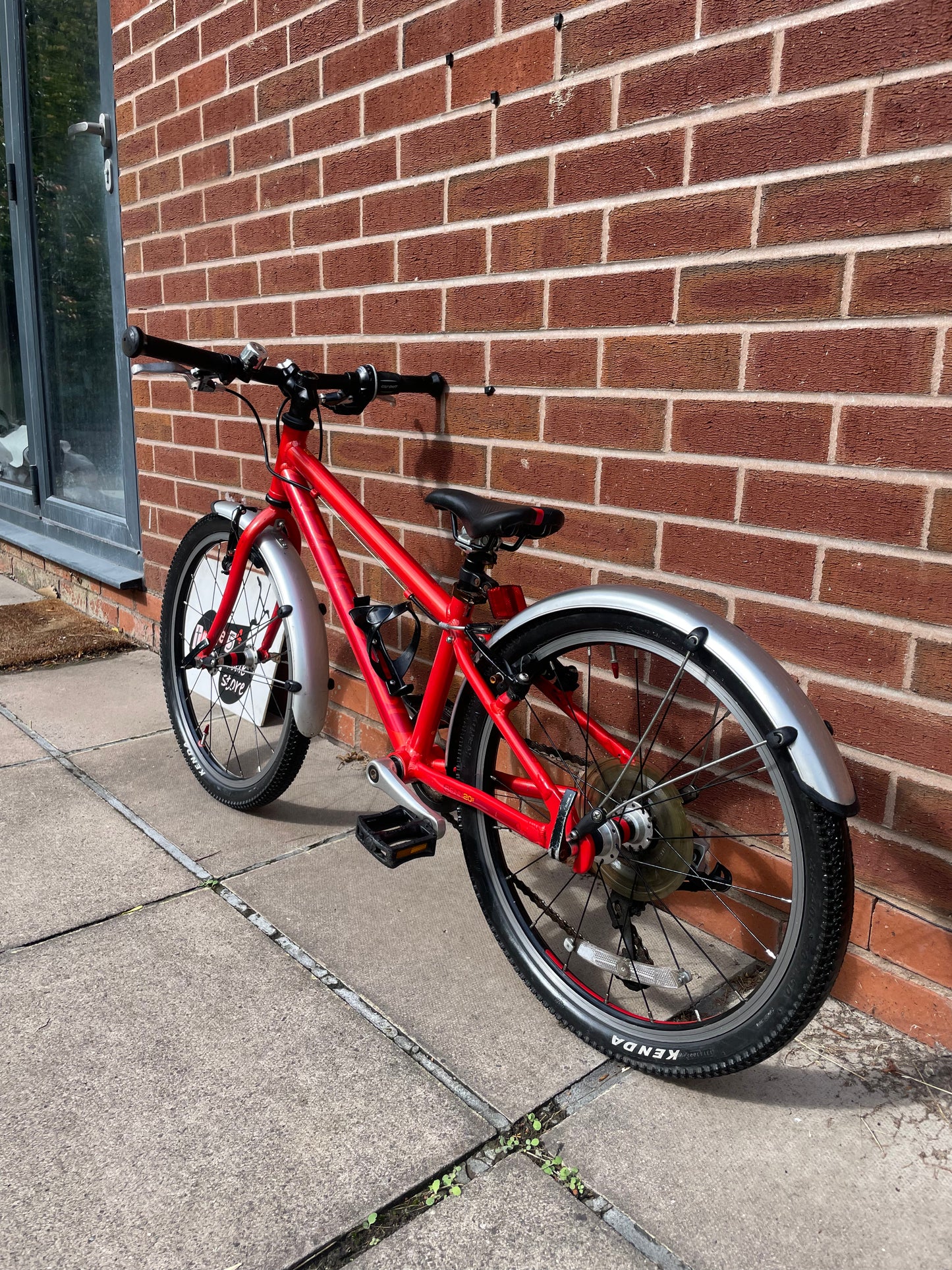 A Pre Loved Isla Bike For Sale, Red Isla Beinn 20s, 20” wheels, 8 speed, mudguards, bottle cage, very lightweight children’s bike, nationwide delivery is available.