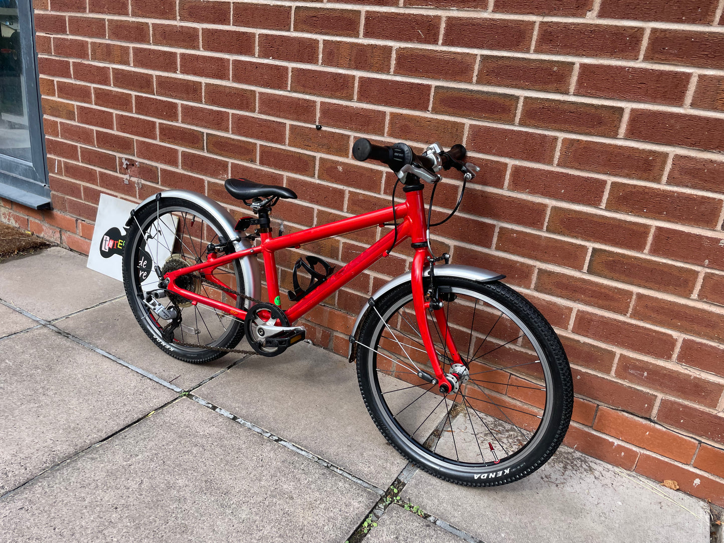 A Pre Loved Isla Bike For Sale, Red Isla Beinn 20s, 20” wheels, 8 speed, mudguards, bottle cage, very lightweight children’s bike, nationwide delivery is available.