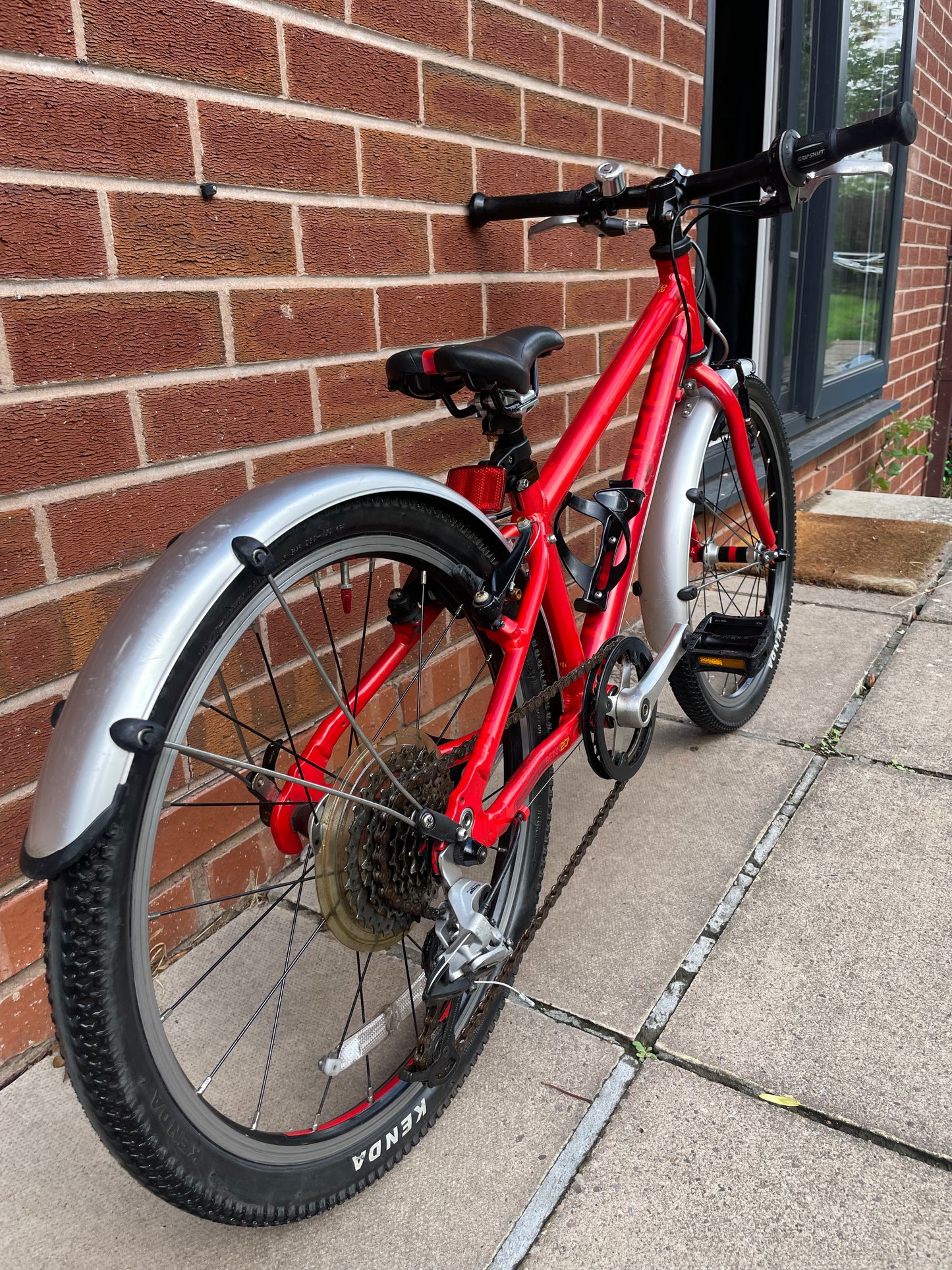 A Pre Loved Isla Bike For Sale, Red Isla Beinn 20s, 20” wheels, 8 speed, mudguards, bottle cage, very lightweight children’s bike, nationwide delivery is available.