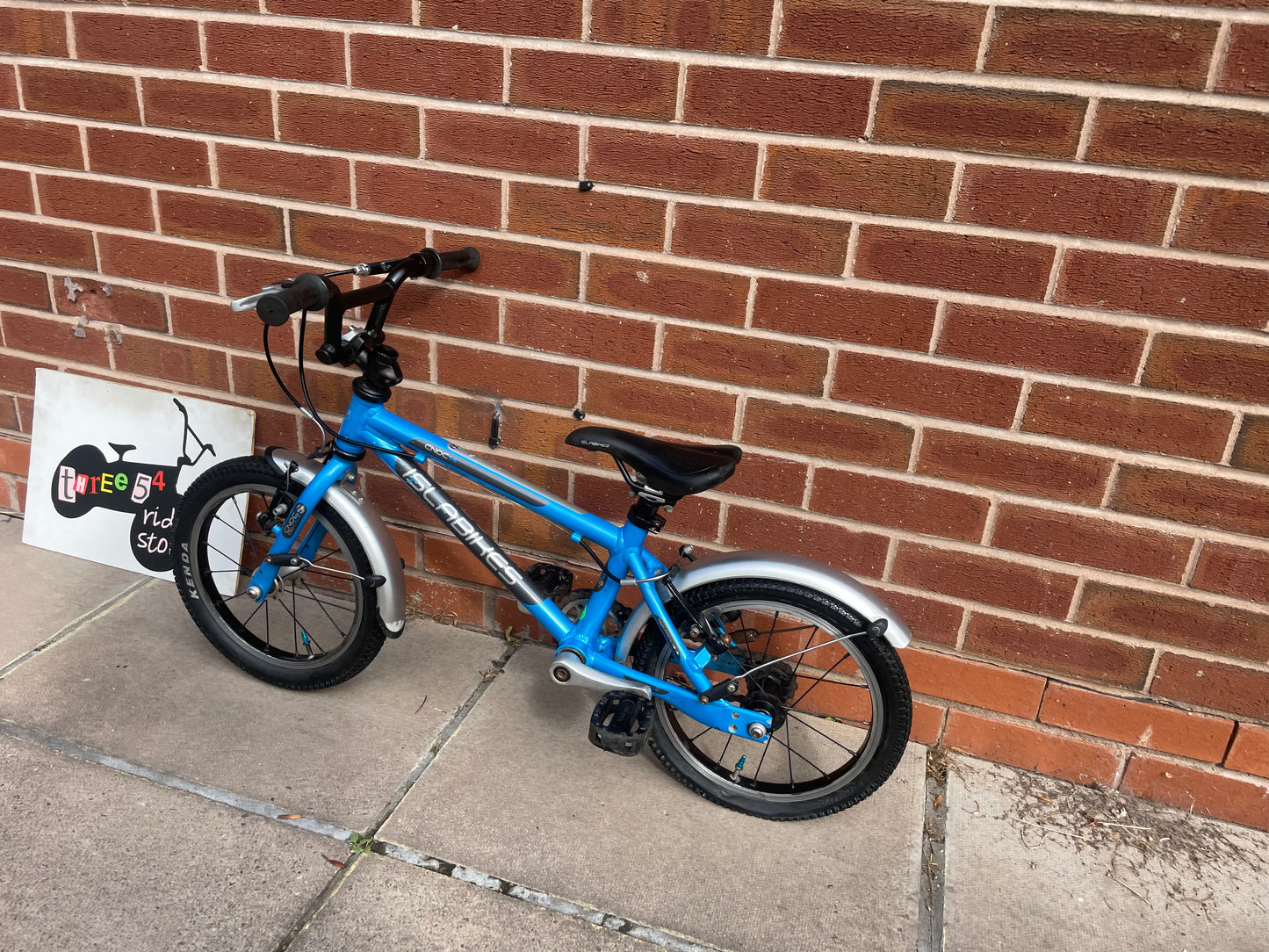 A Pre Loved Isla Cnoc 14 first pedal bike For Sale, Blue, 14” wheels, V brakes, mudguards, very lightweight, nationwide delivery is available.