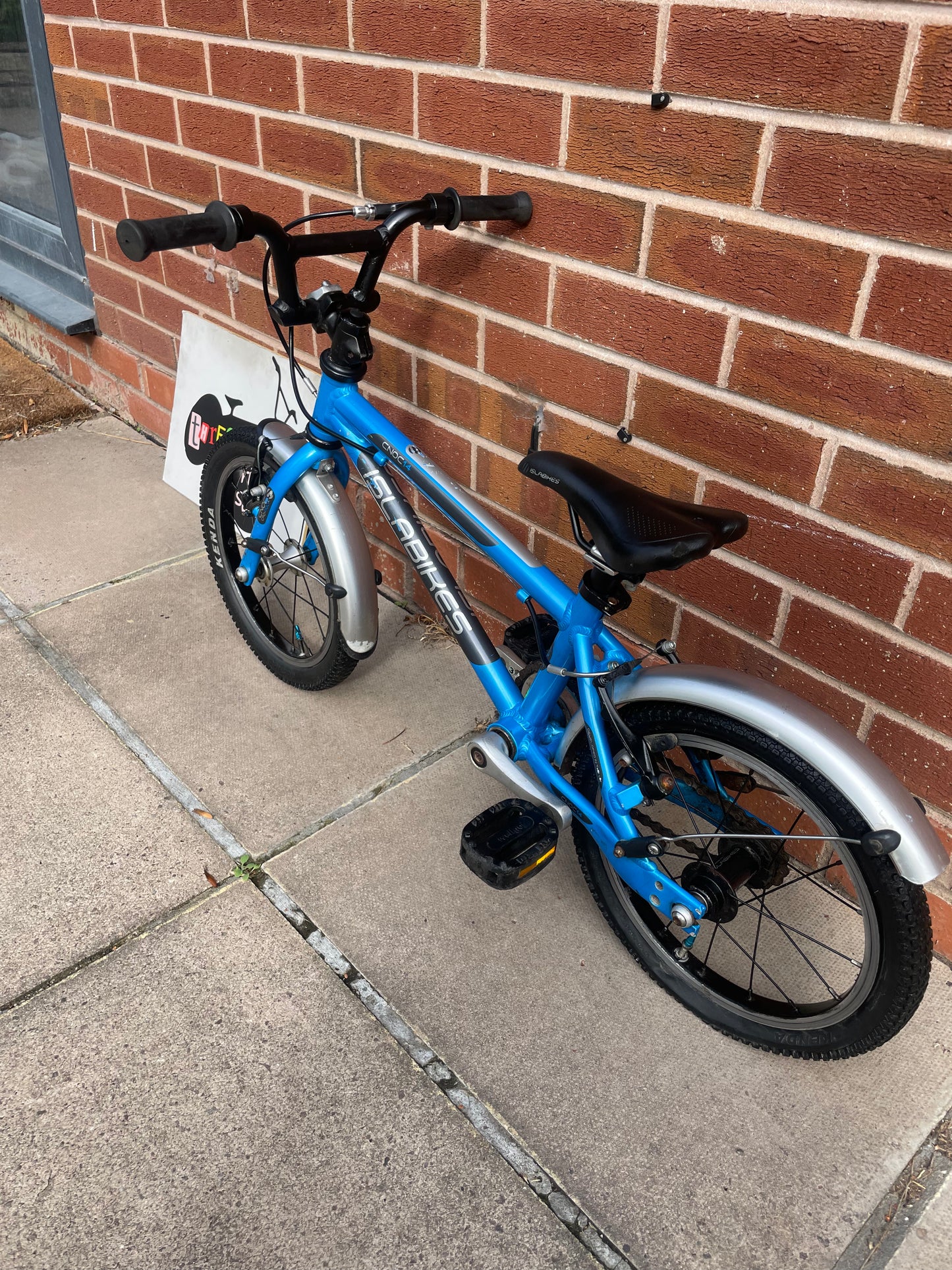 A Pre Loved Isla Cnoc 14 first pedal bike For Sale, Blue, 14” wheels, V brakes, mudguards, very lightweight, nationwide delivery is available.