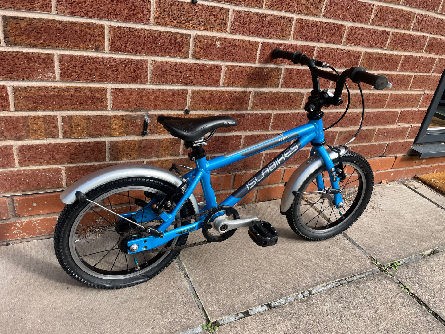 A Pre Loved Isla Cnoc 14 first pedal bike For Sale, Blue, 14” wheels, V brakes, mudguards, very lightweight, nationwide delivery is available.
