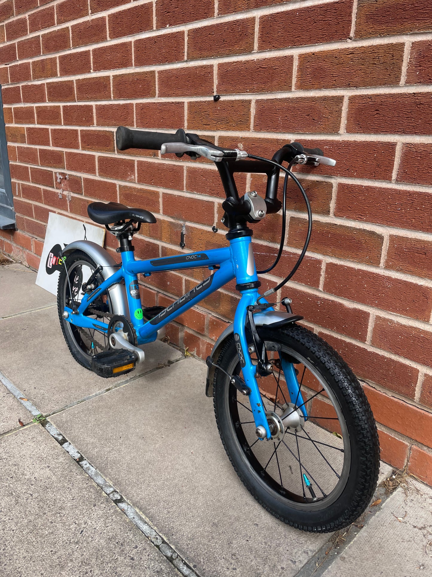 A Pre Loved Isla Cnoc 14 first pedal bike For Sale, Blue, 14” wheels, V brakes, mudguards, very lightweight, nationwide delivery is available.