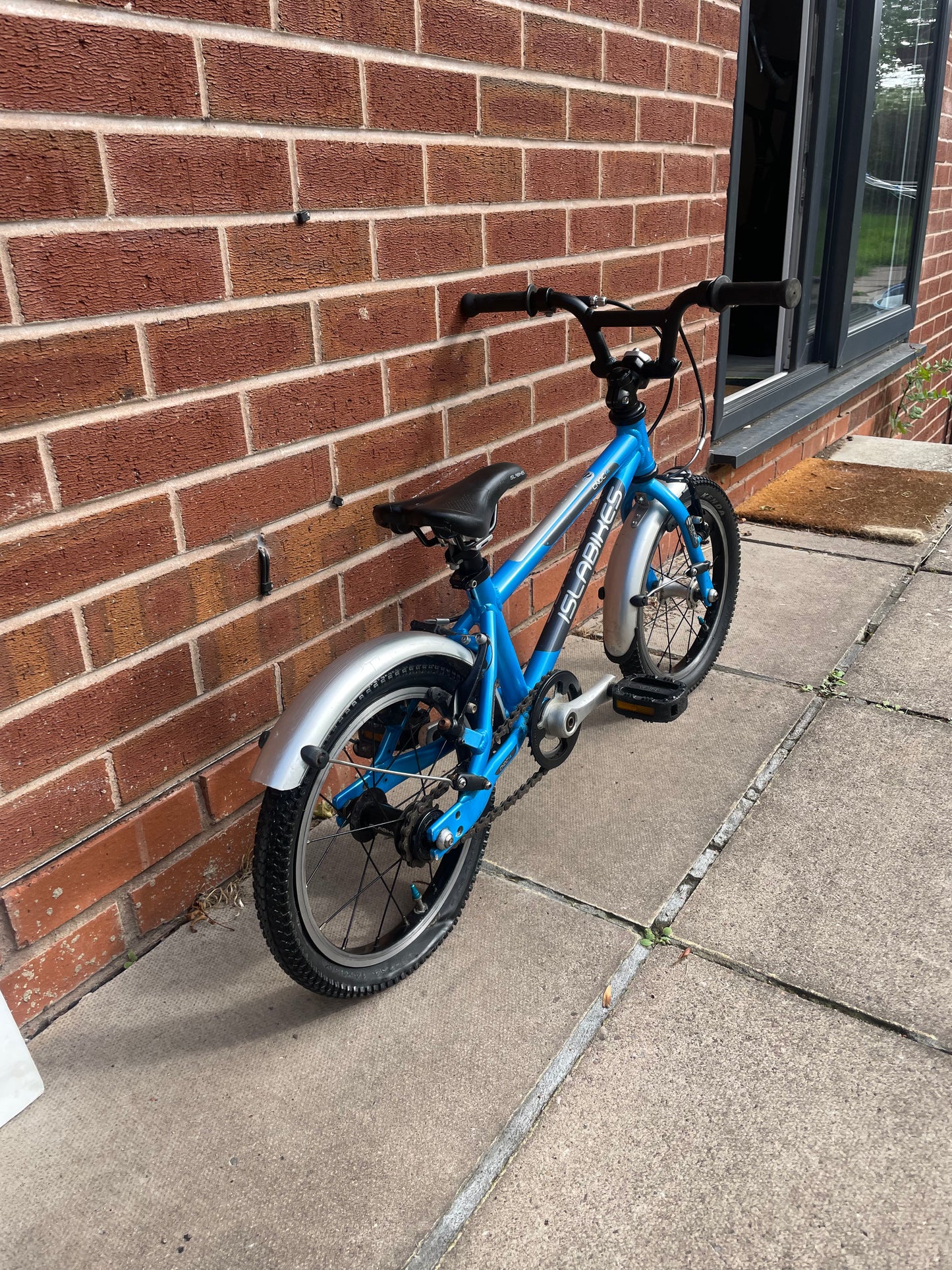 A Pre Loved Isla Cnoc 14 first pedal bike For Sale, Blue, 14” wheels, V brakes, mudguards, very lightweight, nationwide delivery is available.