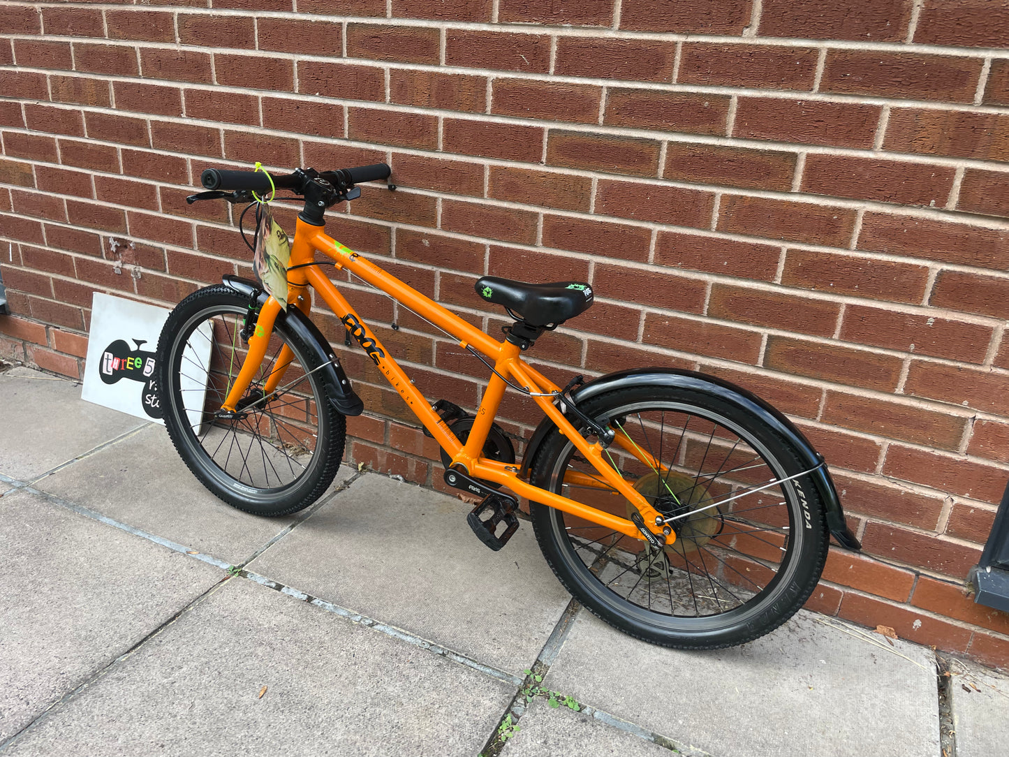 A Pre Loved Frog Bike For Sale, Orange Frog 55, lightweight children’s bicycle, 20” wheels, 8 speed, V brakes, mudguards, nationwide delivery is available.
