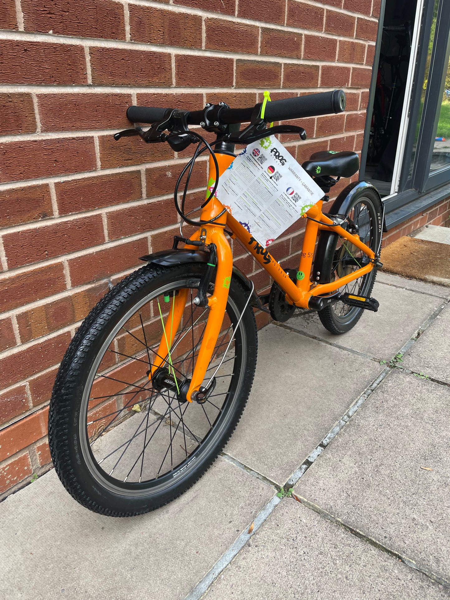 A Pre Loved Frog Bike For Sale, Orange Frog 55, lightweight children’s bicycle, 20” wheels, 8 speed, V brakes, mudguards, nationwide delivery is available.
