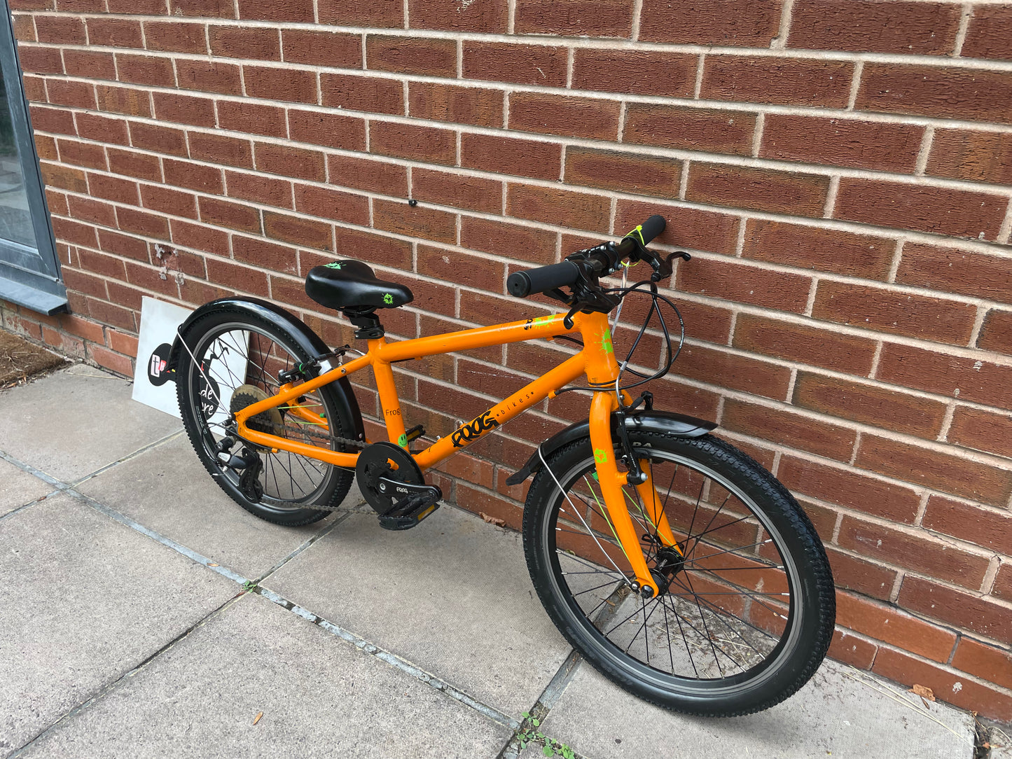 A Pre Loved Frog Bike For Sale, Orange Frog 55, lightweight children’s bicycle, 20” wheels, 8 speed, V brakes, mudguards, nationwide delivery is available.