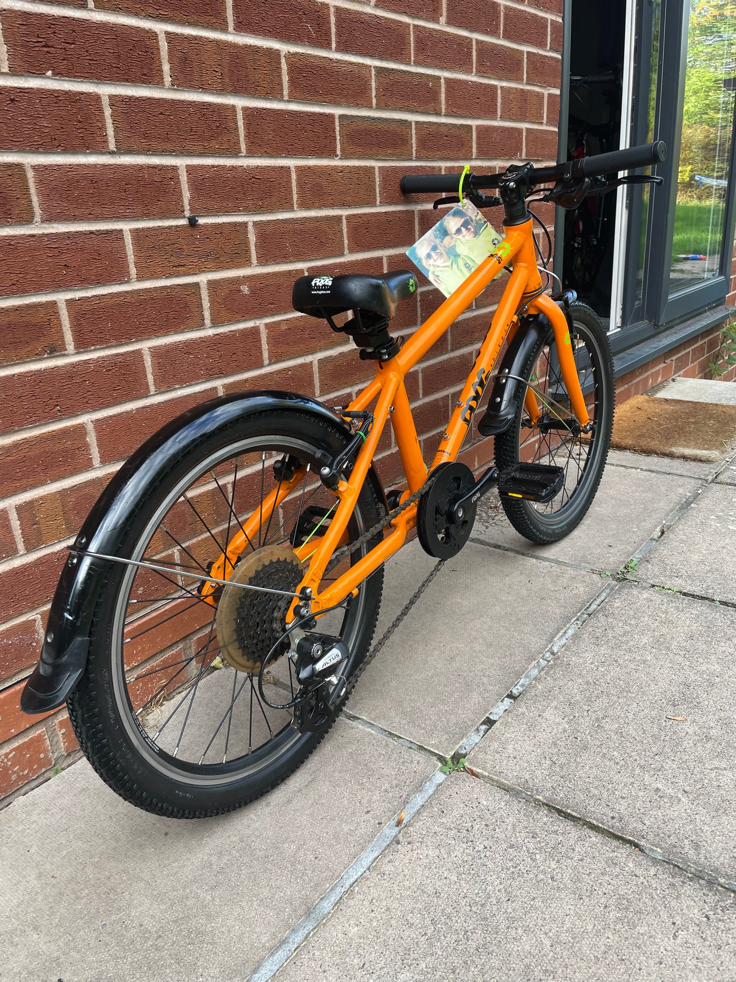 A Pre Loved Frog Bike For Sale, Orange Frog 55, lightweight children’s bicycle, 20” wheels, 8 speed, V brakes, mudguards, nationwide delivery is available.