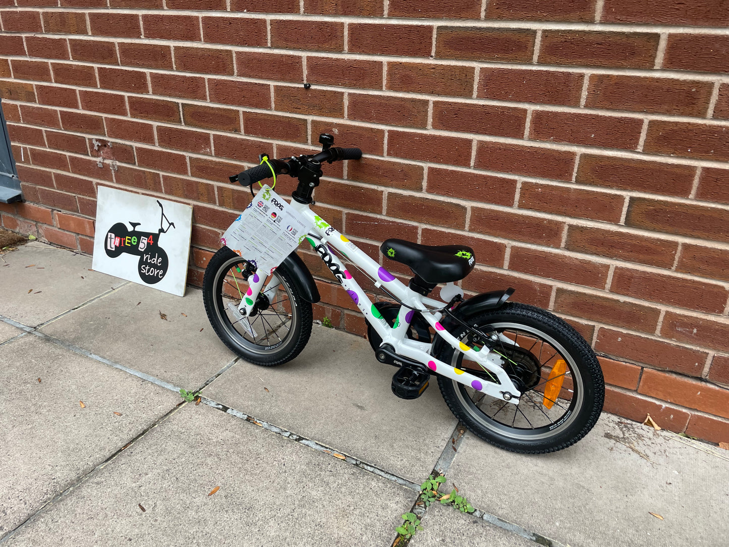 A Pre Loved Frog Bike For Sale, White Spotty Frog 40 first pedal bike, 14” wheels, single speed, padded seat, V brakes, fully enclosed chain, mudguards, nationwide delivery is available.