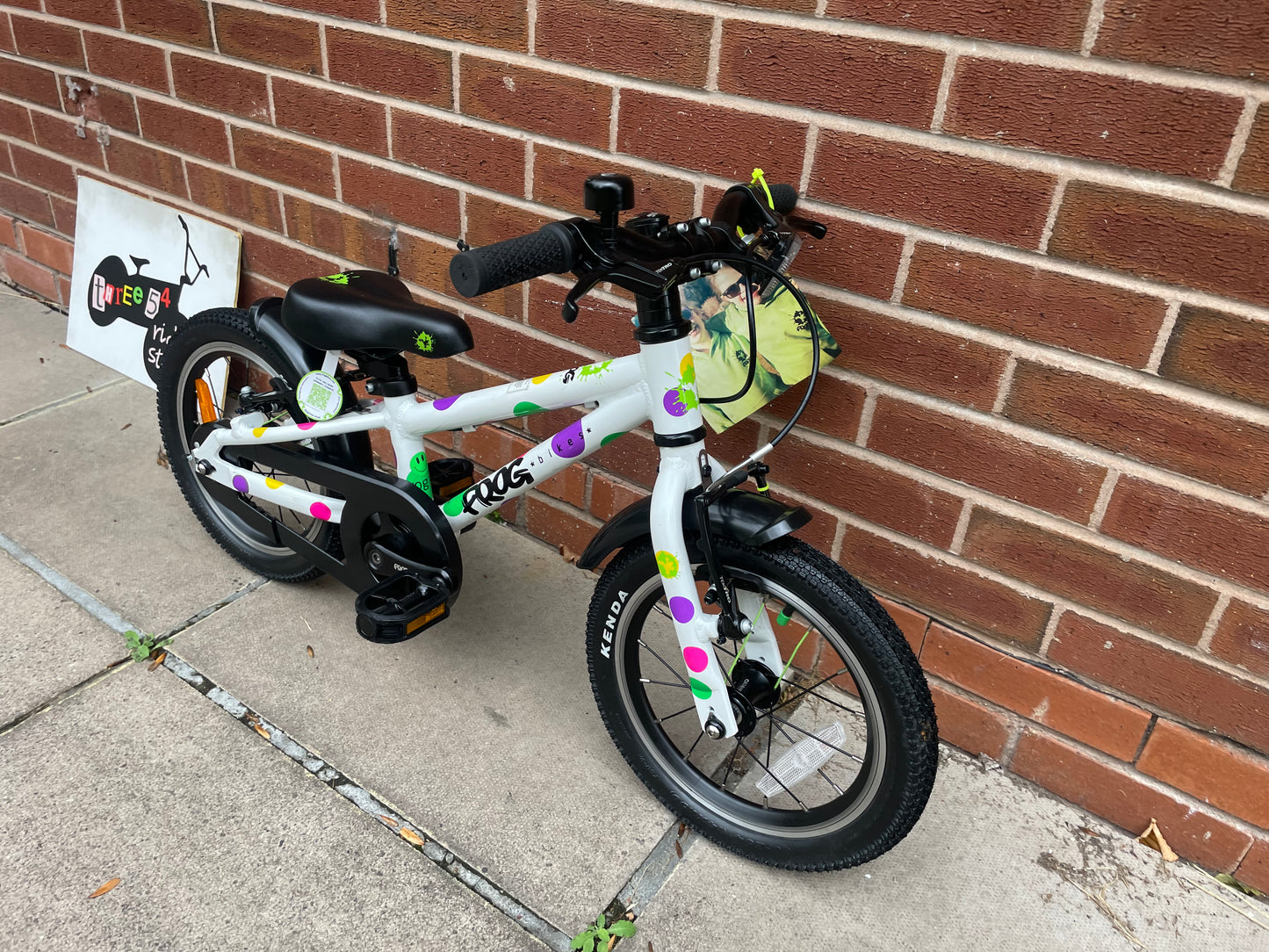 A Pre Loved Frog Bike For Sale, White Spotty Frog 40 first pedal bike, 14” wheels, single speed, padded seat, V brakes, fully enclosed chain, mudguards, nationwide delivery is available.