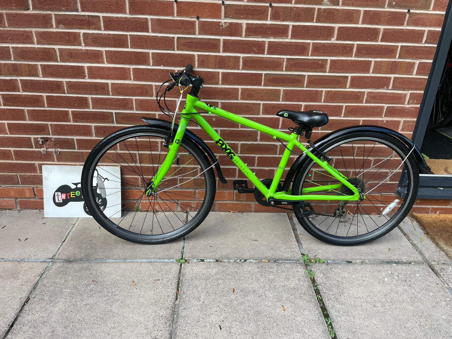 A Pre Loved Frog Bike For Sale, Green Frog 69 26” wheel hybrid bike, 8 speed, V brakes, mudguards, very lightweight, excellent condition, nationwide delivery is available.