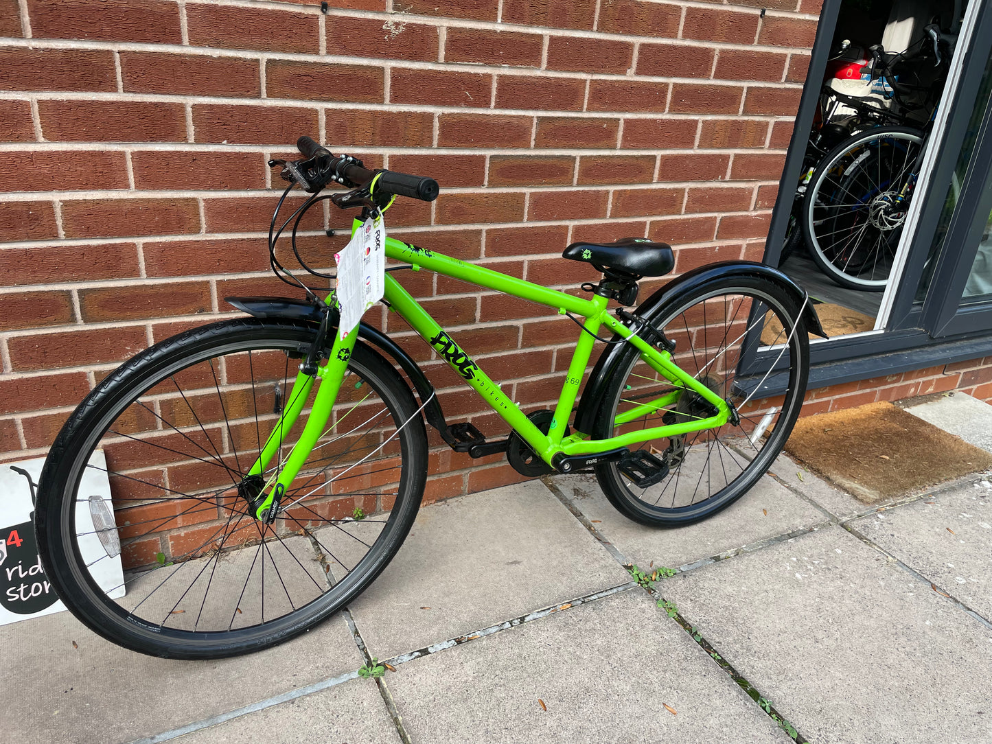 A Pre Loved Frog Bike For Sale, Green Frog 69 26” wheel hybrid bike, 8 speed, V brakes, mudguards, very lightweight, excellent condition, nationwide delivery is available.
