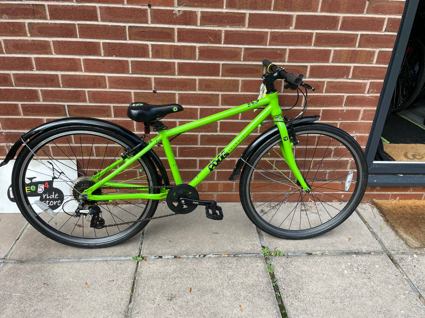 A Pre Loved Frog Bike For Sale, Green Frog 69 26” wheel hybrid bike, 8 speed, V brakes, mudguards, very lightweight, excellent condition, nationwide delivery is available.