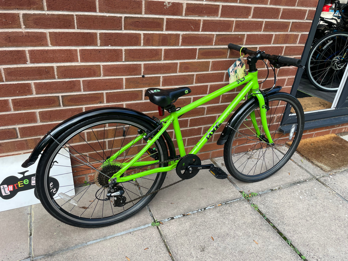 A Pre Loved Frog Bike For Sale, Green Frog 69 26” wheel hybrid bike, 8 speed, V brakes, mudguards, very lightweight, excellent condition, nationwide delivery is available.