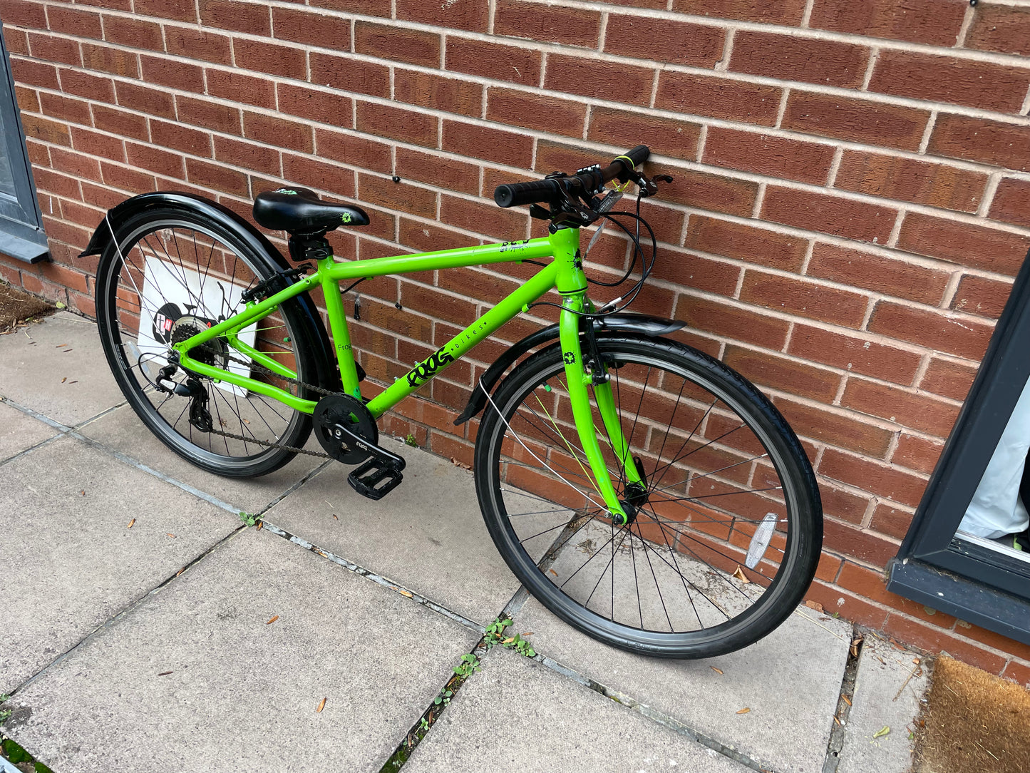 A Pre Loved Frog Bike For Sale, Green Frog 69 26” wheel hybrid bike, 8 speed, V brakes, mudguards, very lightweight, excellent condition, nationwide delivery is available.