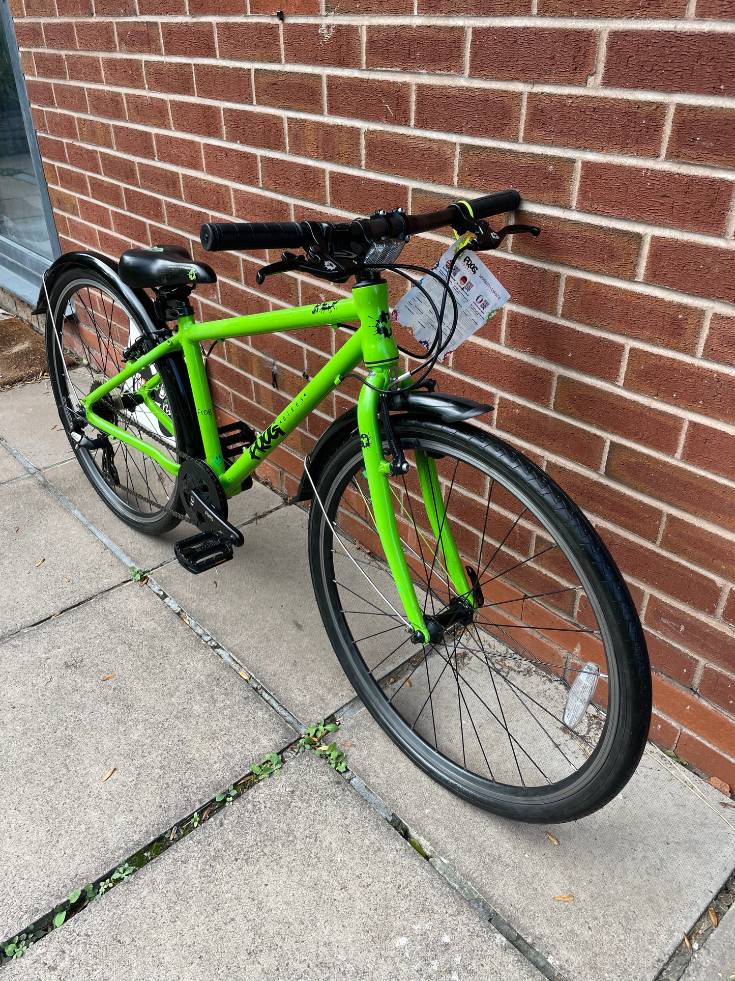 A Pre Loved Frog Bike For Sale, Green Frog 69 26” wheel hybrid bike, 8 speed, V brakes, mudguards, very lightweight, excellent condition, nationwide delivery is available.