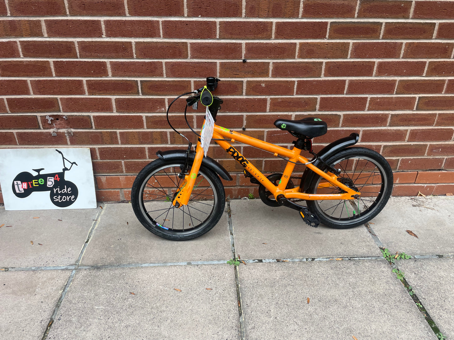 A Pre Loved Frog Bike For Sale, Orange Frog 48 first pedal bike, lightweight, 16” wheels, mudguards, V brakes, nationwide delivery is available.