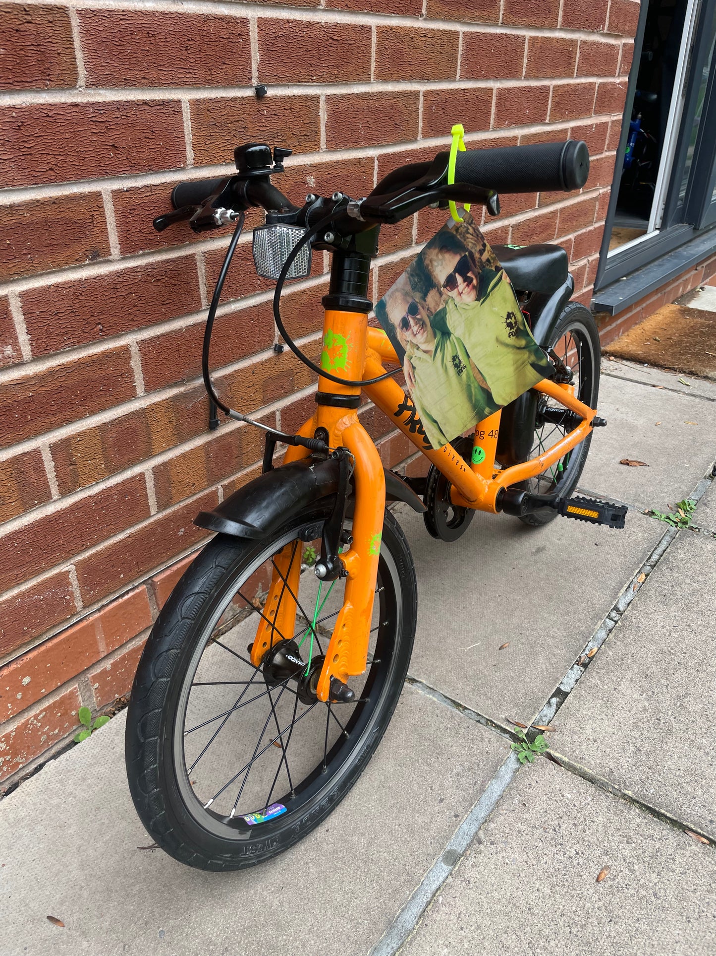 A Pre Loved Frog Bike For Sale, Orange Frog 48 first pedal bike, lightweight, 16” wheels, mudguards, V brakes, nationwide delivery is available.