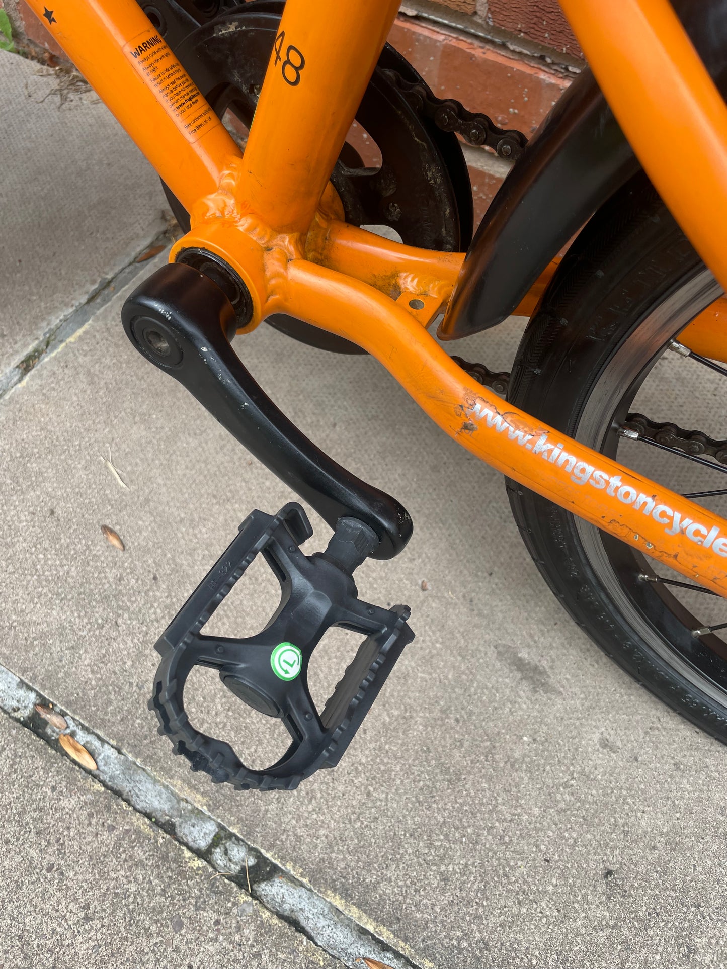 A Pre Loved Frog Bike For Sale, Orange Frog 48 first pedal bike, lightweight, 16” wheels, mudguards, V brakes, nationwide delivery is available.