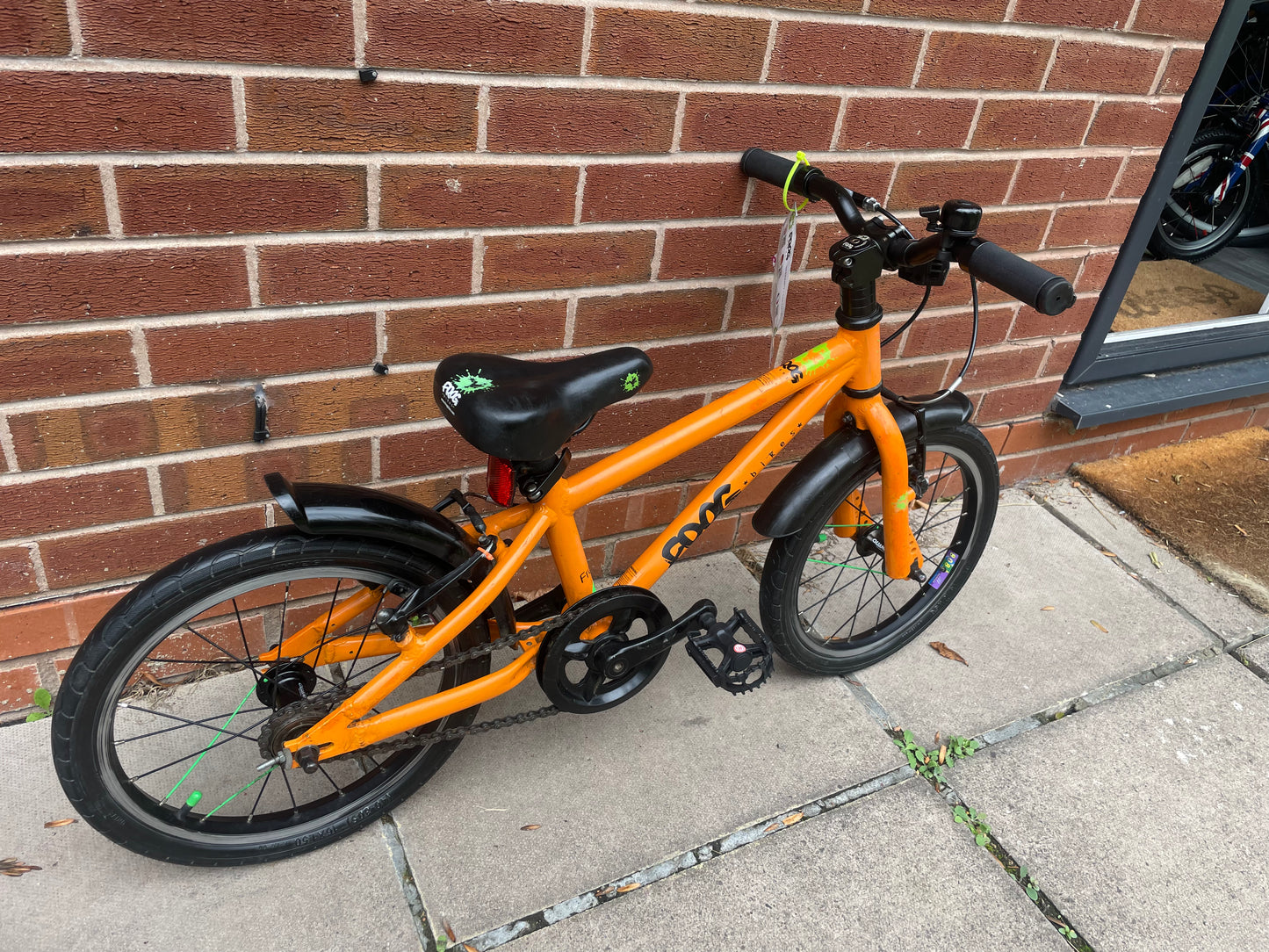 A Pre Loved Frog Bike For Sale, Orange Frog 48 first pedal bike, lightweight, 16” wheels, mudguards, V brakes, nationwide delivery is available.