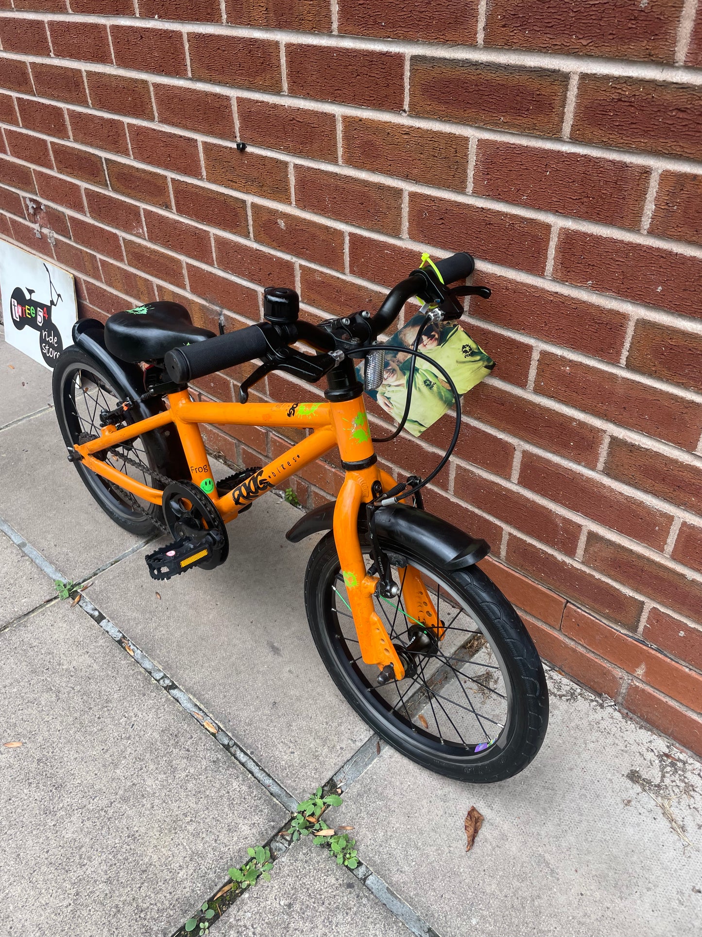 A Pre Loved Frog Bike For Sale, Orange Frog 48 first pedal bike, lightweight, 16” wheels, mudguards, V brakes, nationwide delivery is available.