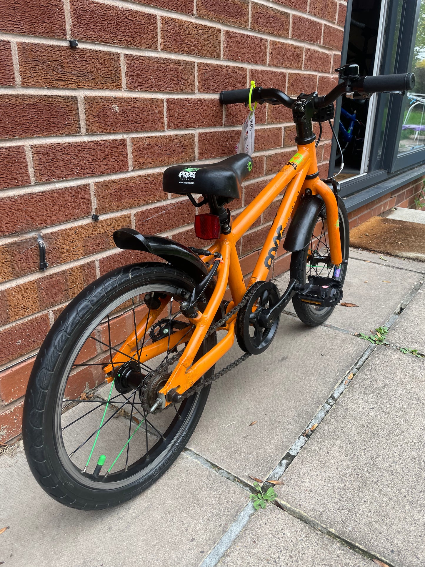 A Pre Loved Frog Bike For Sale, Orange Frog 48 first pedal bike, lightweight, 16” wheels, mudguards, V brakes, nationwide delivery is available.
