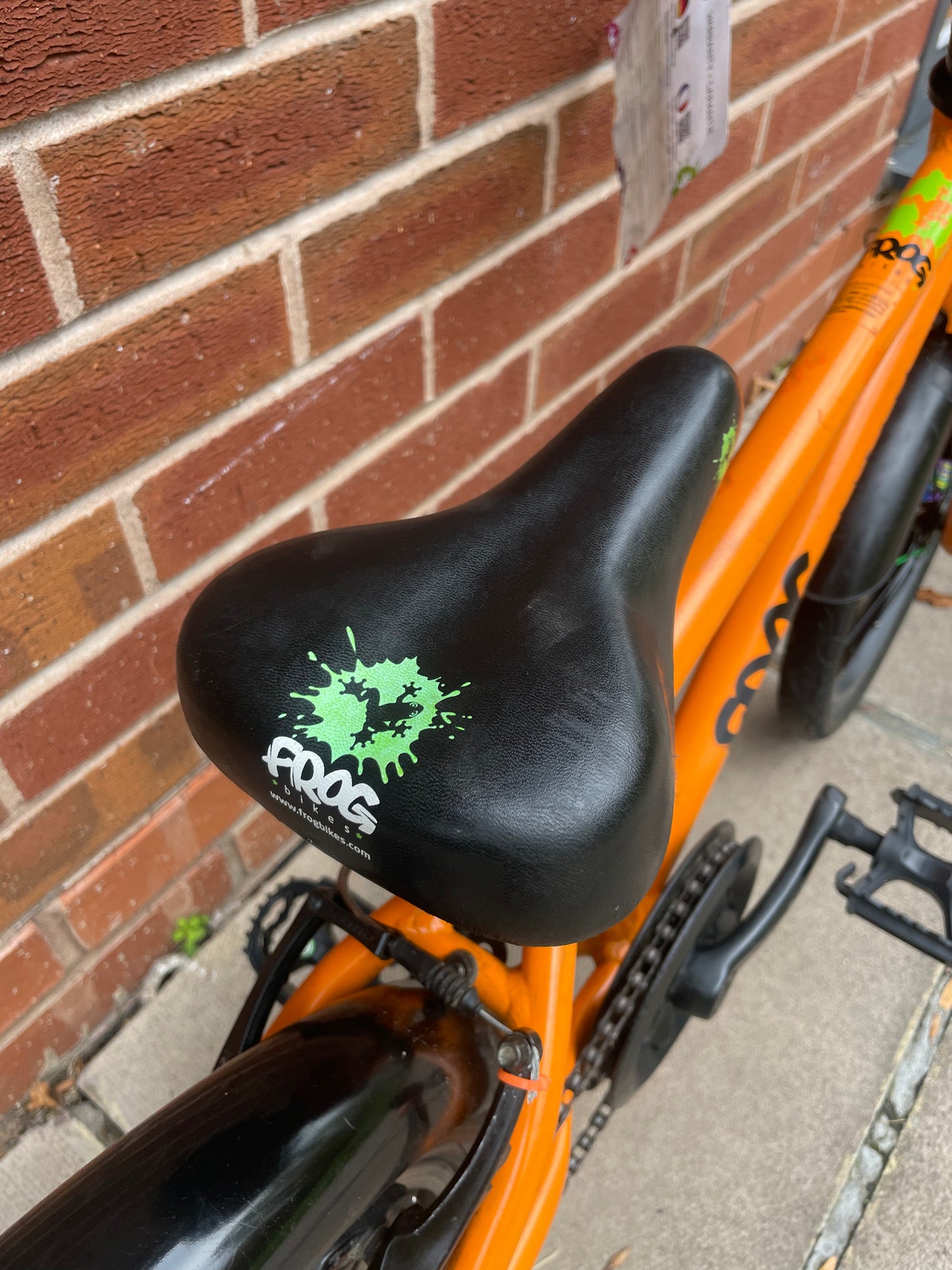 A Pre Loved Frog Bike For Sale, Orange Frog 48 first pedal bike, lightweight, 16” wheels, mudguards, V brakes, nationwide delivery is available.