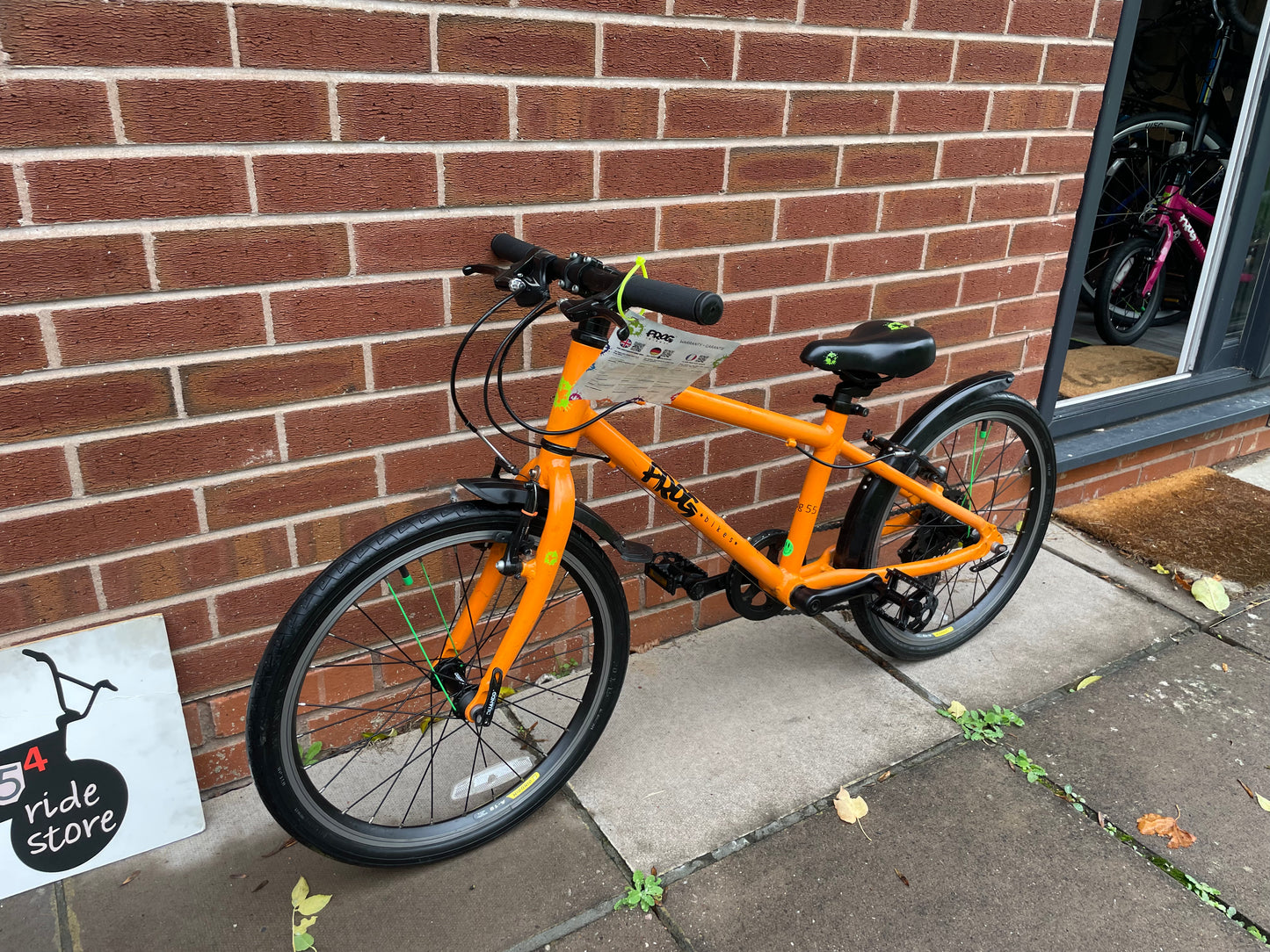 A Pre Loved Frog Bike For Sale, Orange Frog 55, 20” wheels, 8 speed, V brakes, mudguards, very lightweight, nationwide delivery is available.
