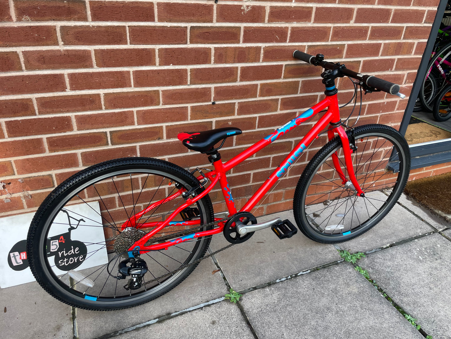 A Pre Loved Squish Bike For Sale, Red, 26” wheels, 8 speed, V brakes, very lightweight children’s bicycle, nationwide delivery is available.