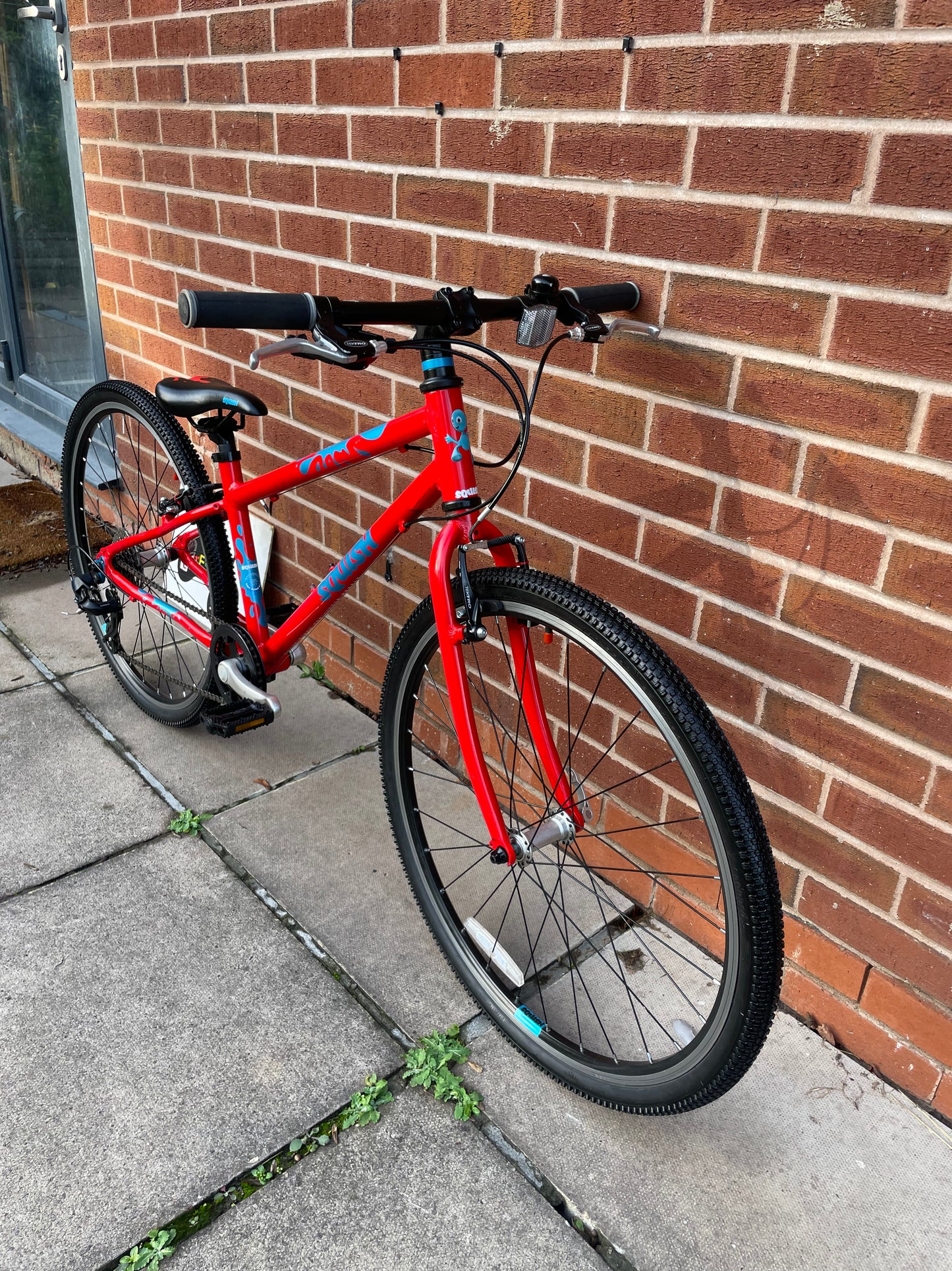 A Pre Loved Squish Bike For Sale, Red, 26” wheels, 8 speed, V brakes, very lightweight children’s bicycle, nationwide delivery is available.