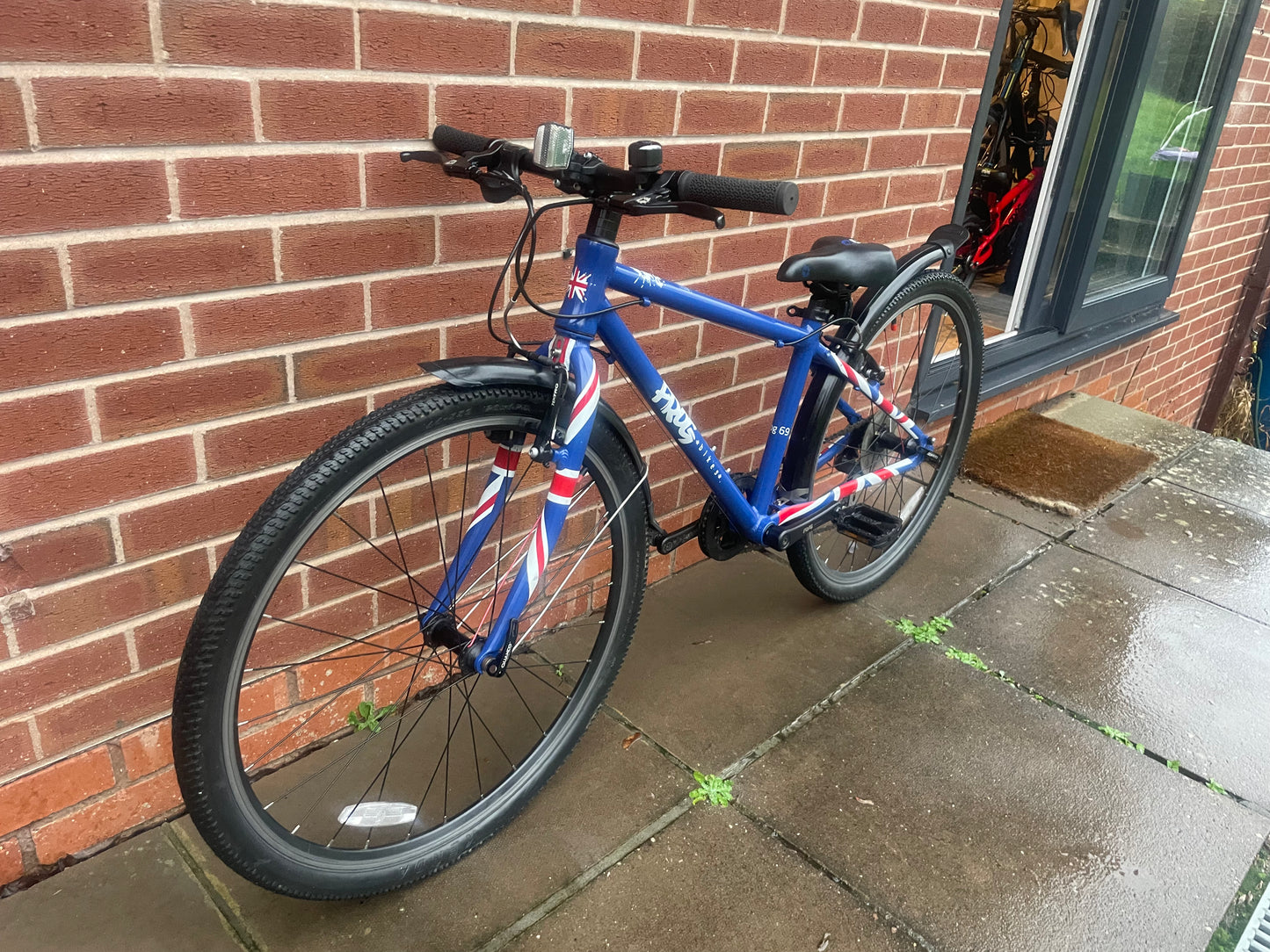 A Pre Loved Frog Bike For Sale, Blue Frog 69 26” wheel hybrid bicycle, 8 speed, V brakes, mudguards, very lightweight, nationwide delivery is available.