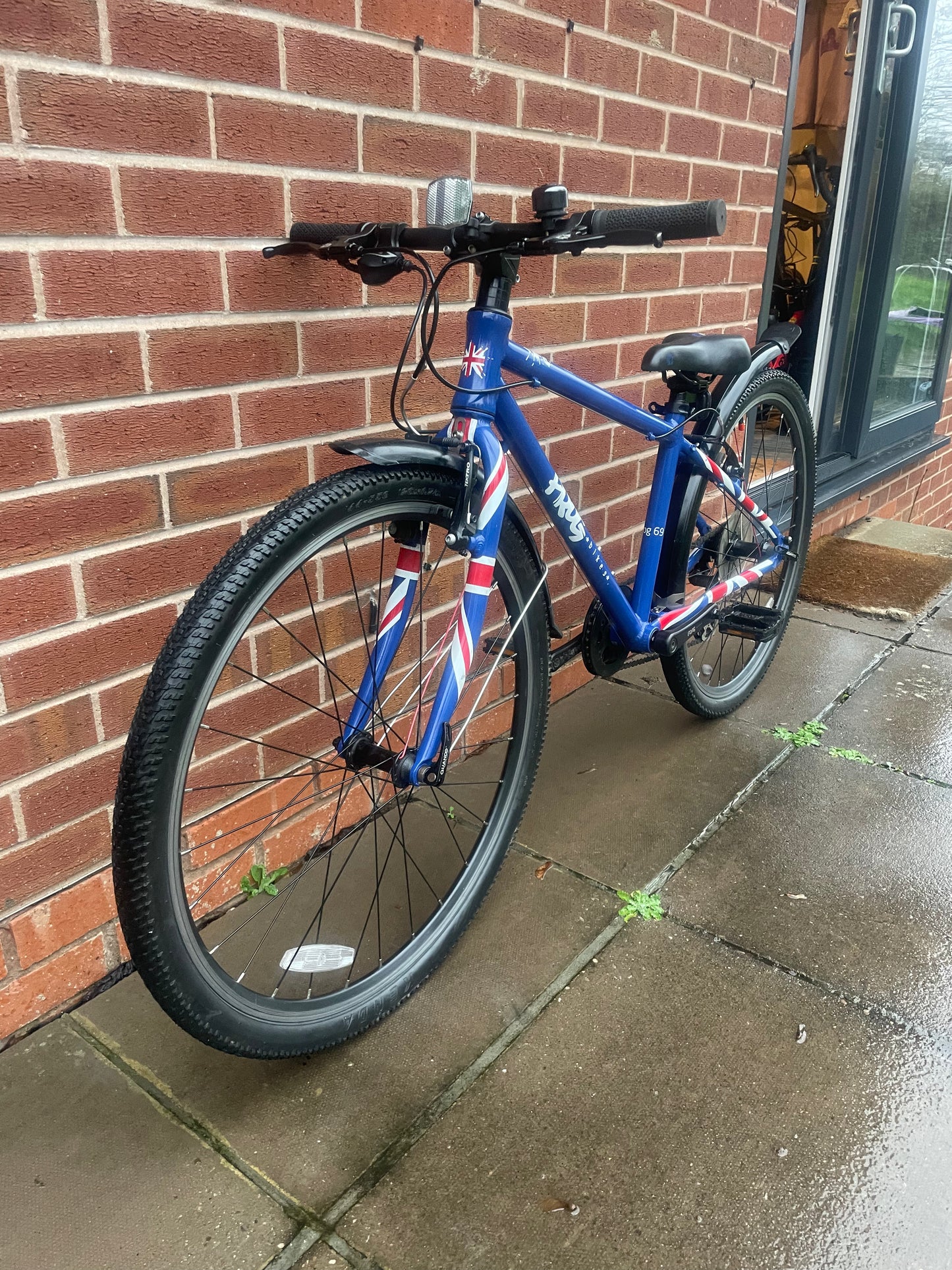 A Pre Loved Frog Bike For Sale, Blue Frog 69 26” wheel hybrid bicycle, 8 speed, V brakes, mudguards, very lightweight, nationwide delivery is available.
