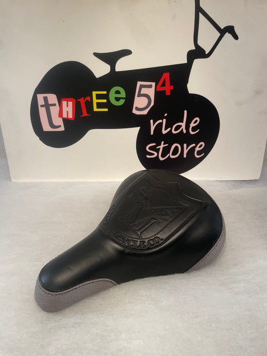 S&M bicycles shield logo seat, black and grey, excellent used condition.