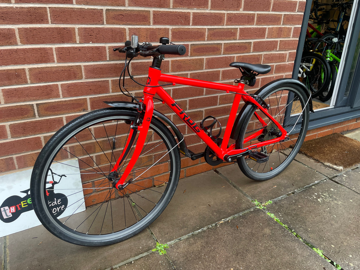 A Pre Loved Frog Bike For Sale Neon Red Frog 73, 26” wheels, 8 speed, V brakes, mudguards, bottle cage, very lightweight, nationwide delivery is available.